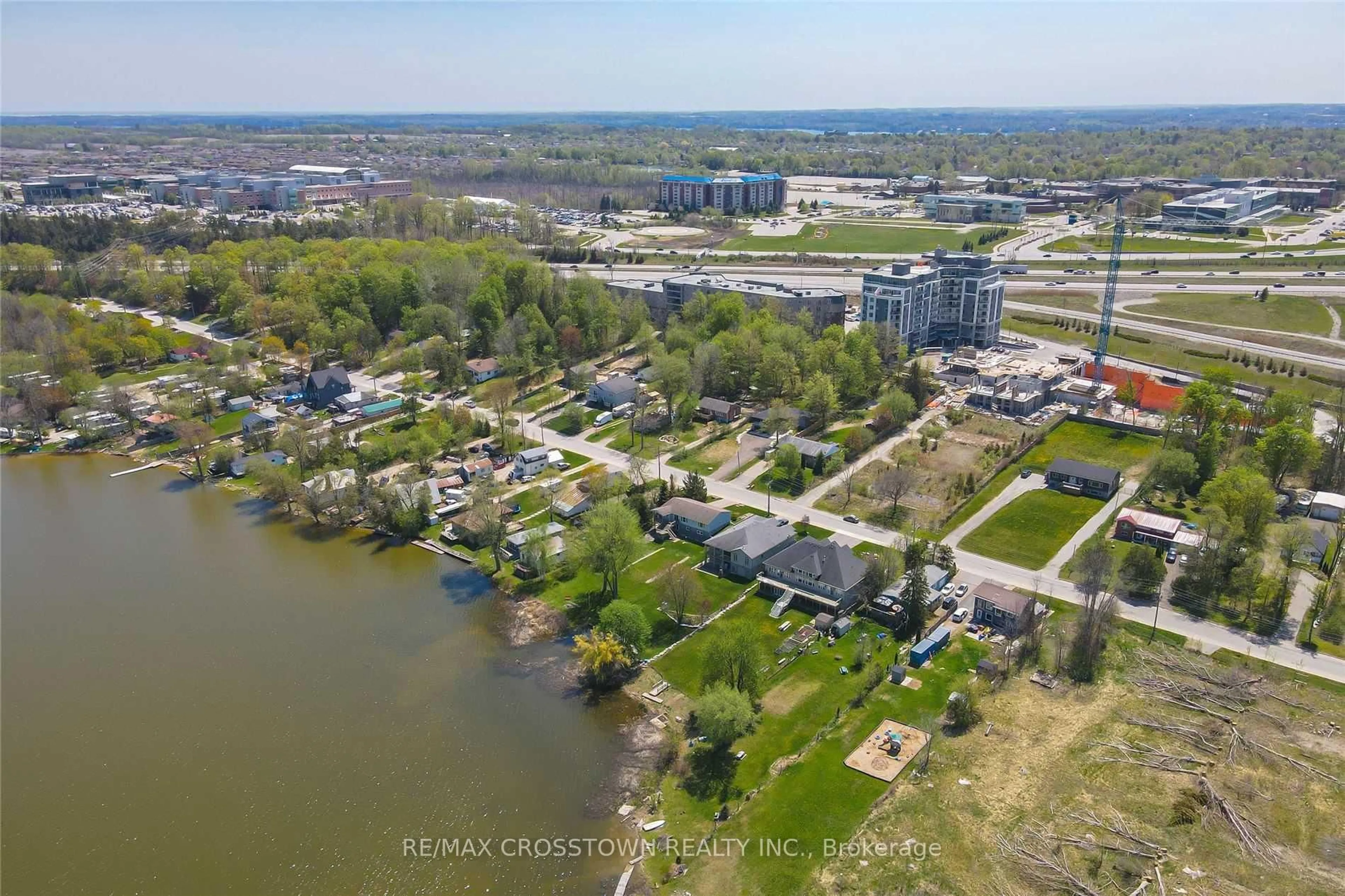 A pic from outside/outdoor area/front of a property/back of a property/a pic from drone, water/lake/river/ocean view for 58 LAKESIDE Terr #712, Barrie Ontario L4M 0H9