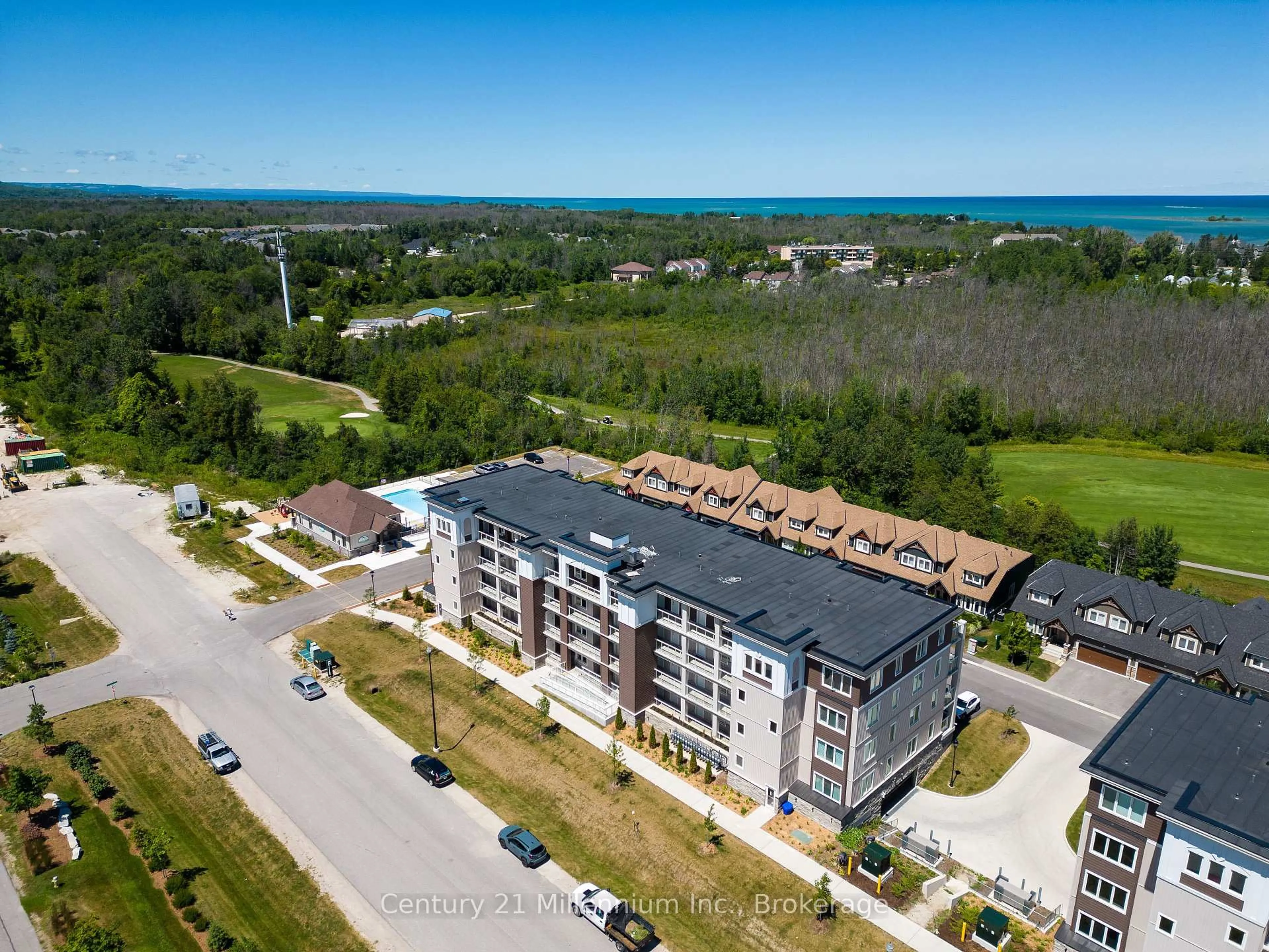 A pic from outside/outdoor area/front of a property/back of a property/a pic from drone, water/lake/river/ocean view for 17 Spooner Cres #205, Collingwood Ontario L9Y 1T3