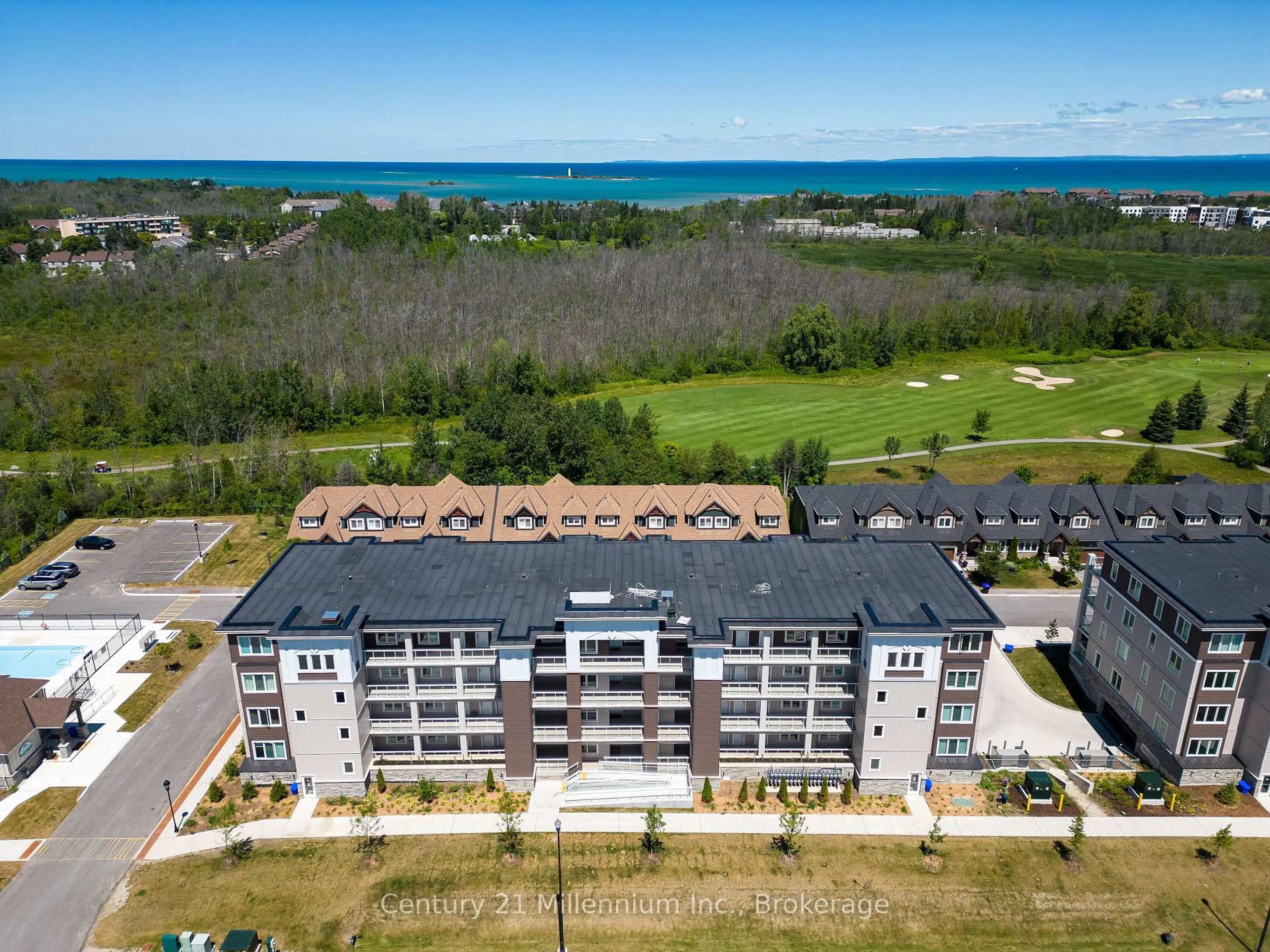 A pic from outside/outdoor area/front of a property/back of a property/a pic from drone, water/lake/river/ocean view for 17 Spooner Cres #205, Collingwood Ontario L9Y 1T3