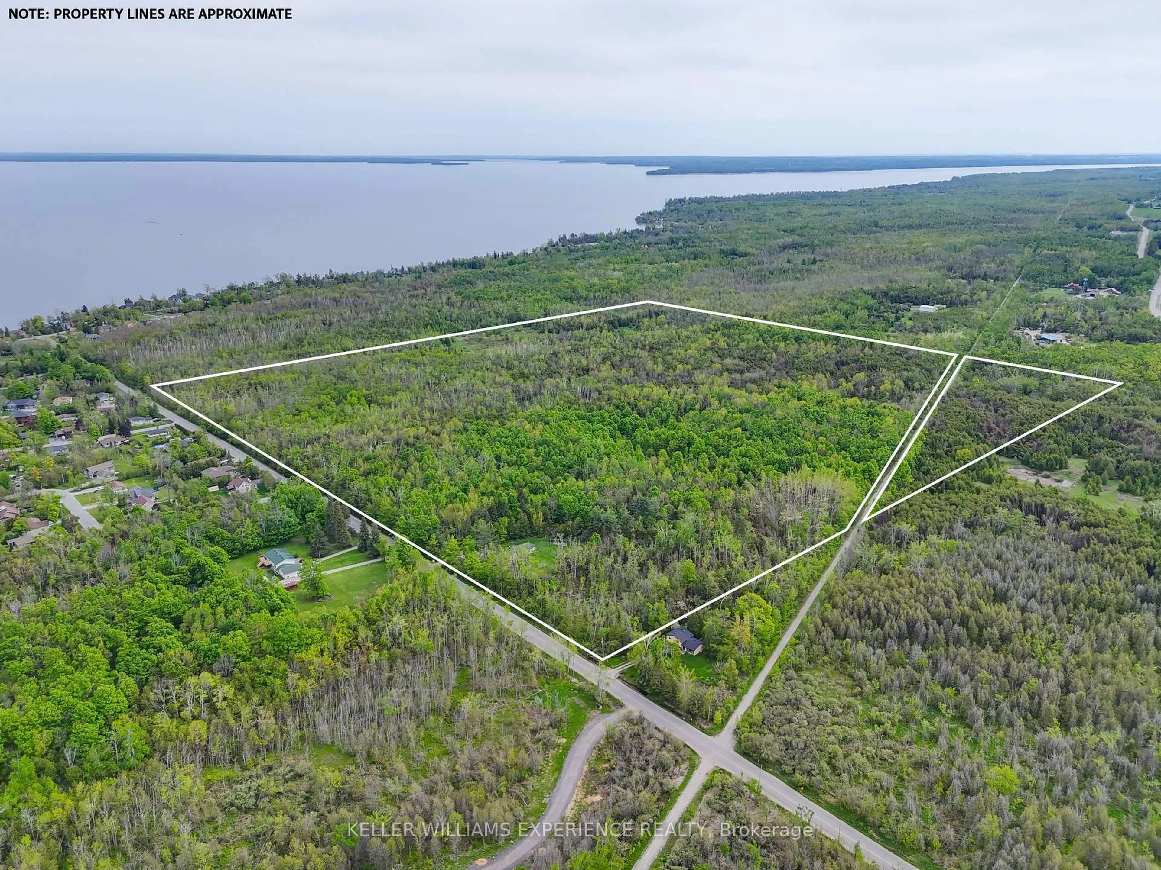 A pic from outside/outdoor area/front of a property/back of a property/a pic from drone, water/lake/river/ocean view for 552 10 Line, Oro-Medonte Ontario L0L 1T0