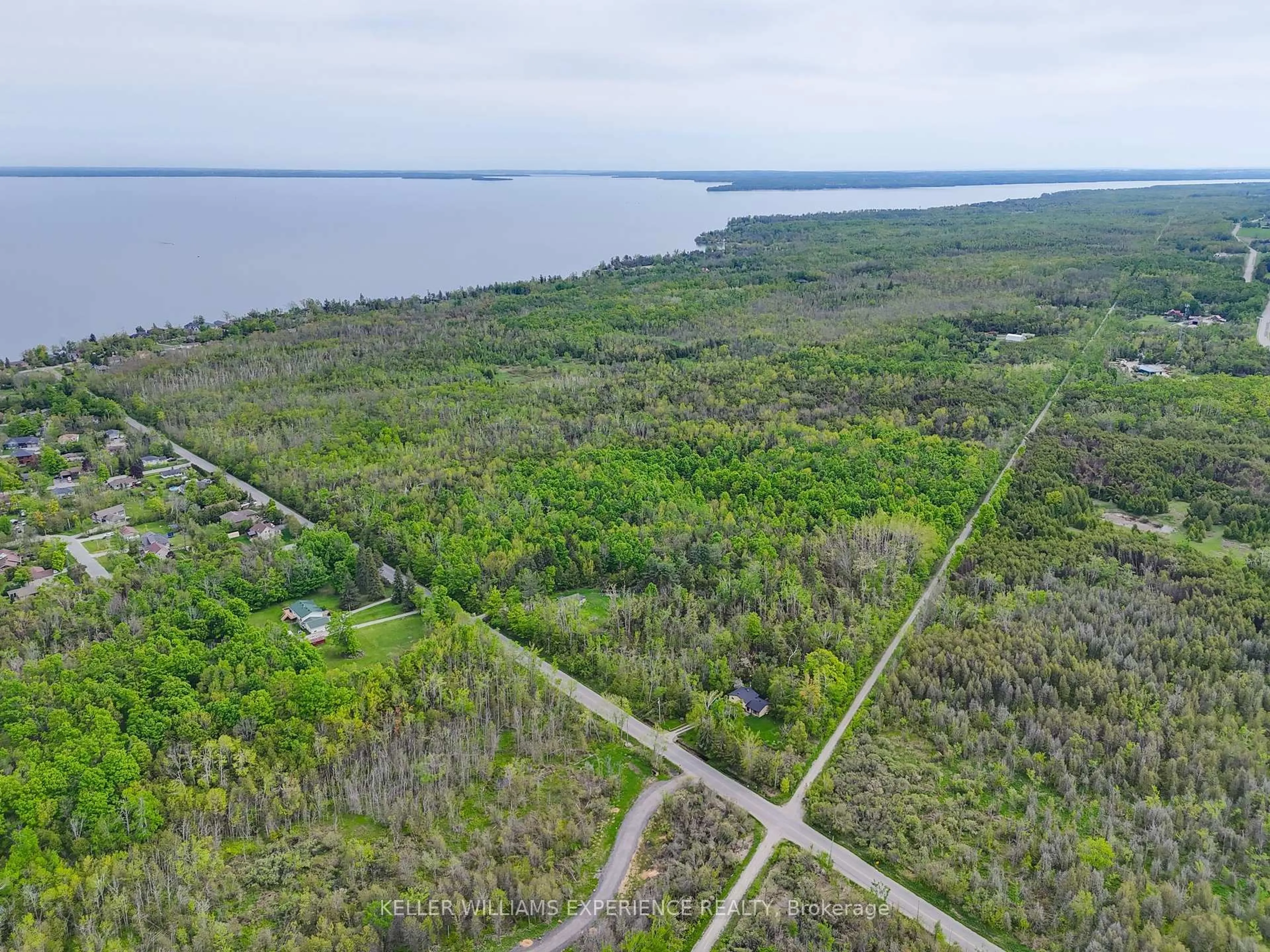 A pic from outside/outdoor area/front of a property/back of a property/a pic from drone, water/lake/river/ocean view for 552 10 Line, Oro-Medonte Ontario L0L 1T0