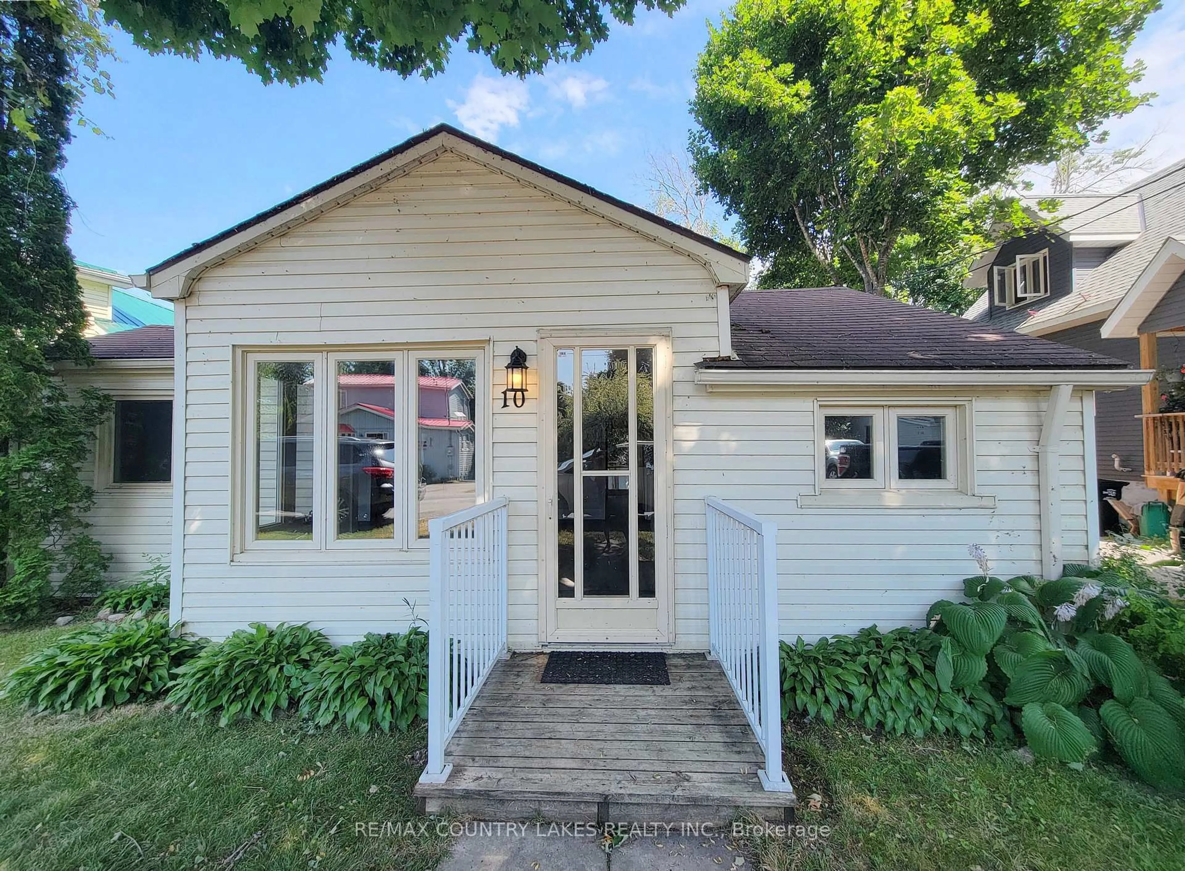 Home with vinyl exterior material, street for 10 Ridge Ave, Ramara Ontario L0K 1B0