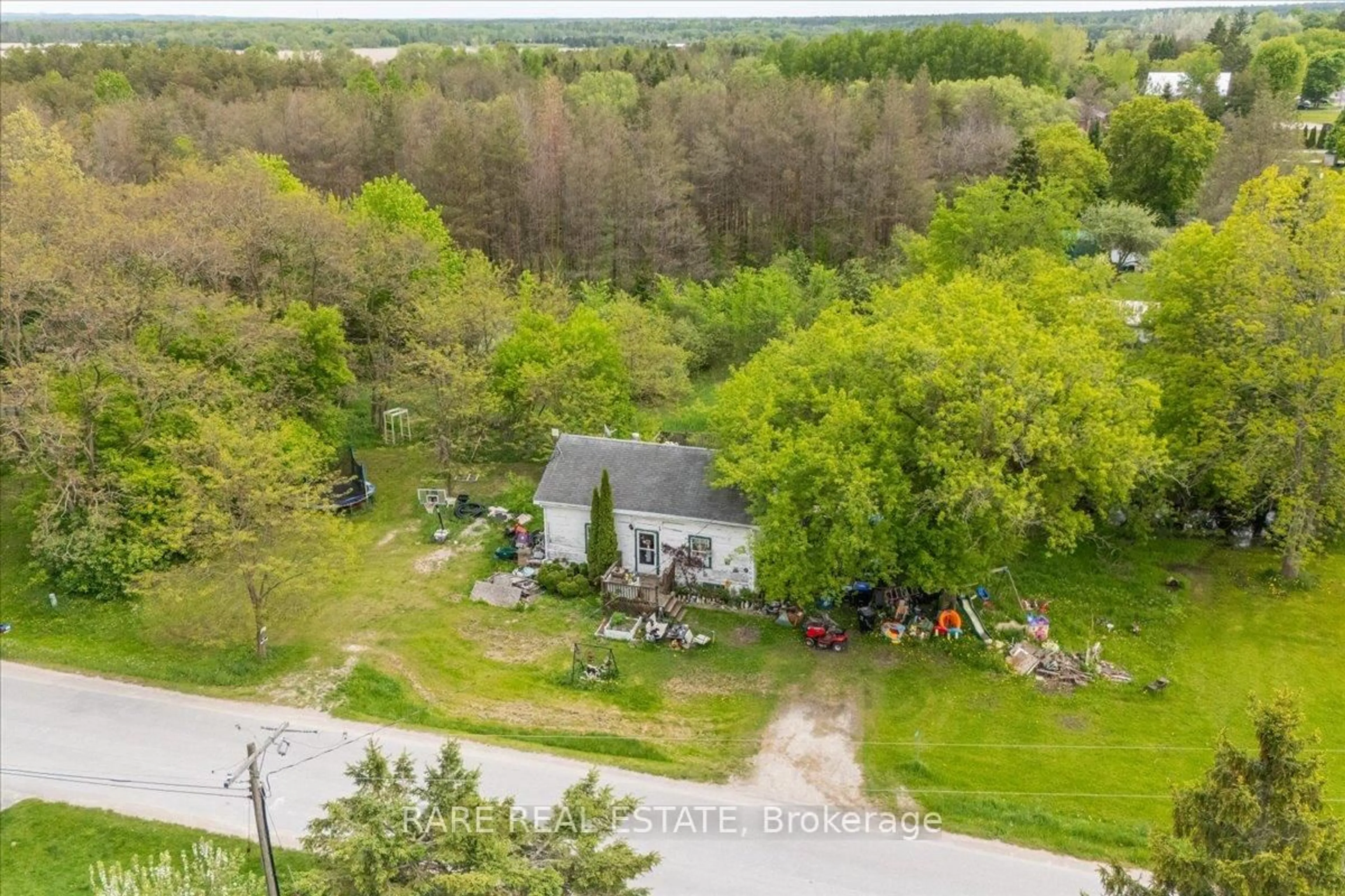 A pic from outside/outdoor area/front of a property/back of a property/a pic from drone, forest/trees view for 4879 SUNNIDALE CON. 2 Rd, Clearview Ontario L0M 1N0