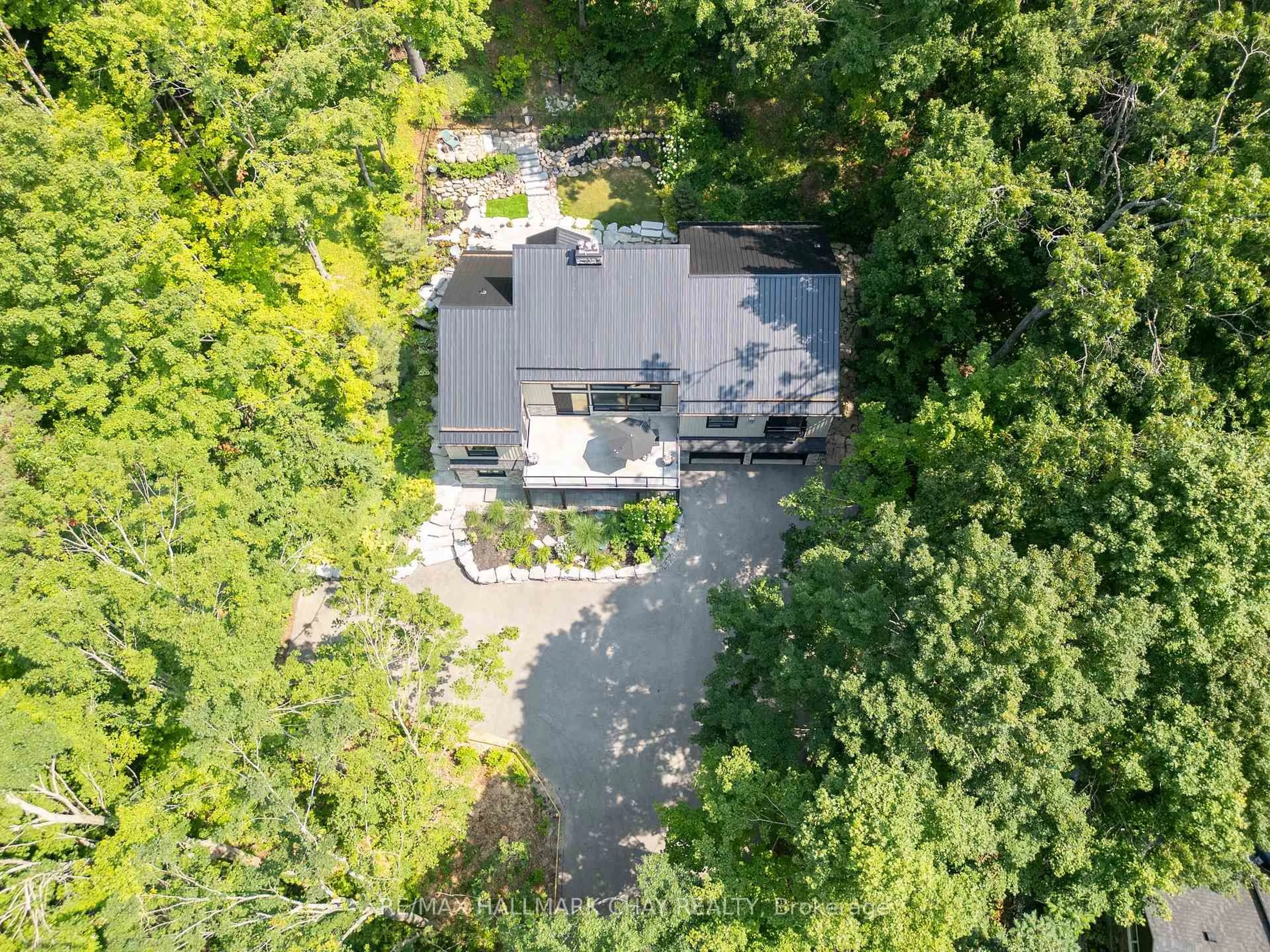 A pic from outside/outdoor area/front of a property/back of a property/a pic from drone, forest/trees view for 2 Pine Spring, Oro-Medonte Ontario L4M 4Y8