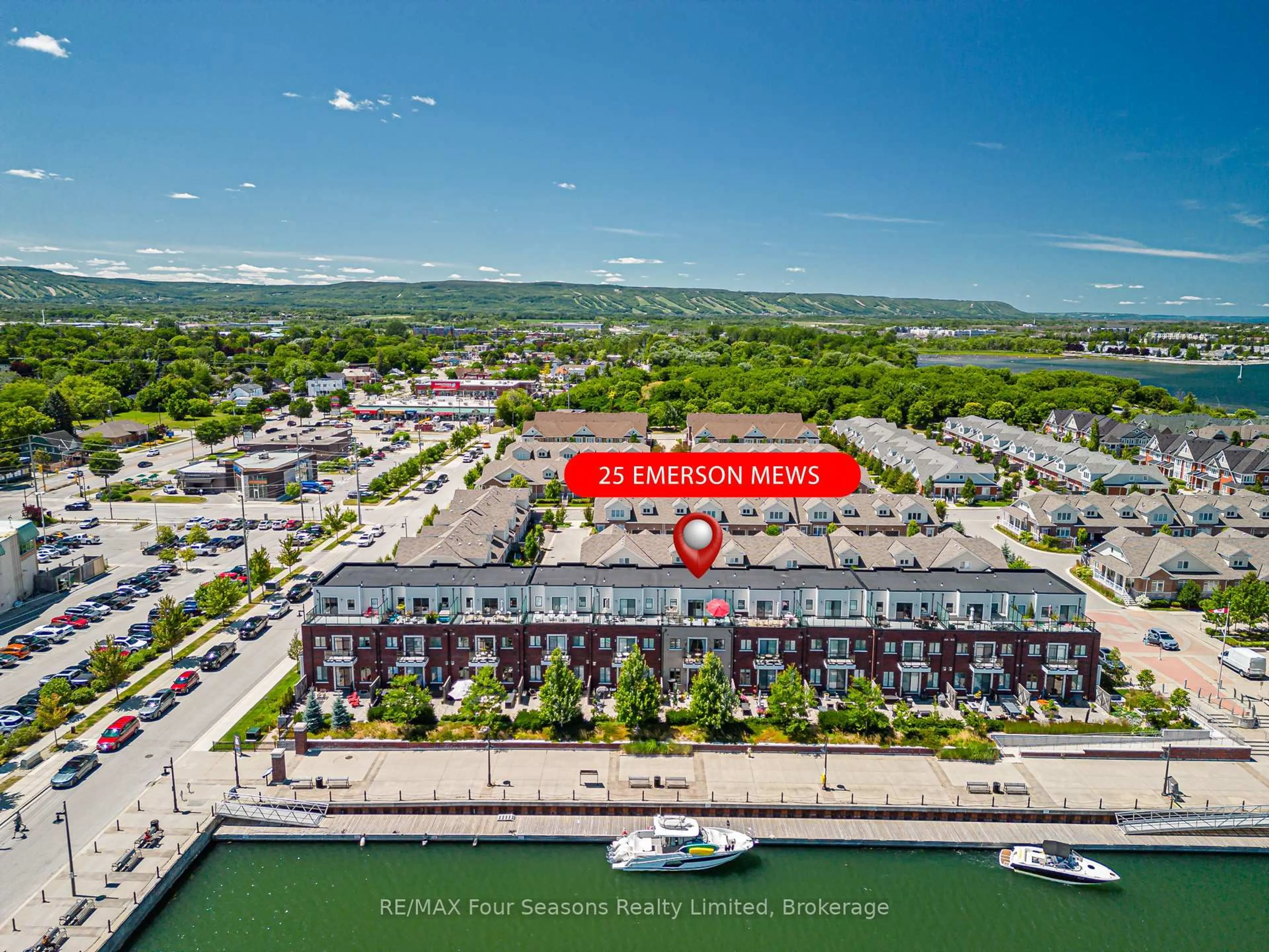 A pic from outside/outdoor area/front of a property/back of a property/a pic from drone, water/lake/river/ocean view for 25 Emerson Mews #6, Collingwood Ontario L9Y 2X4