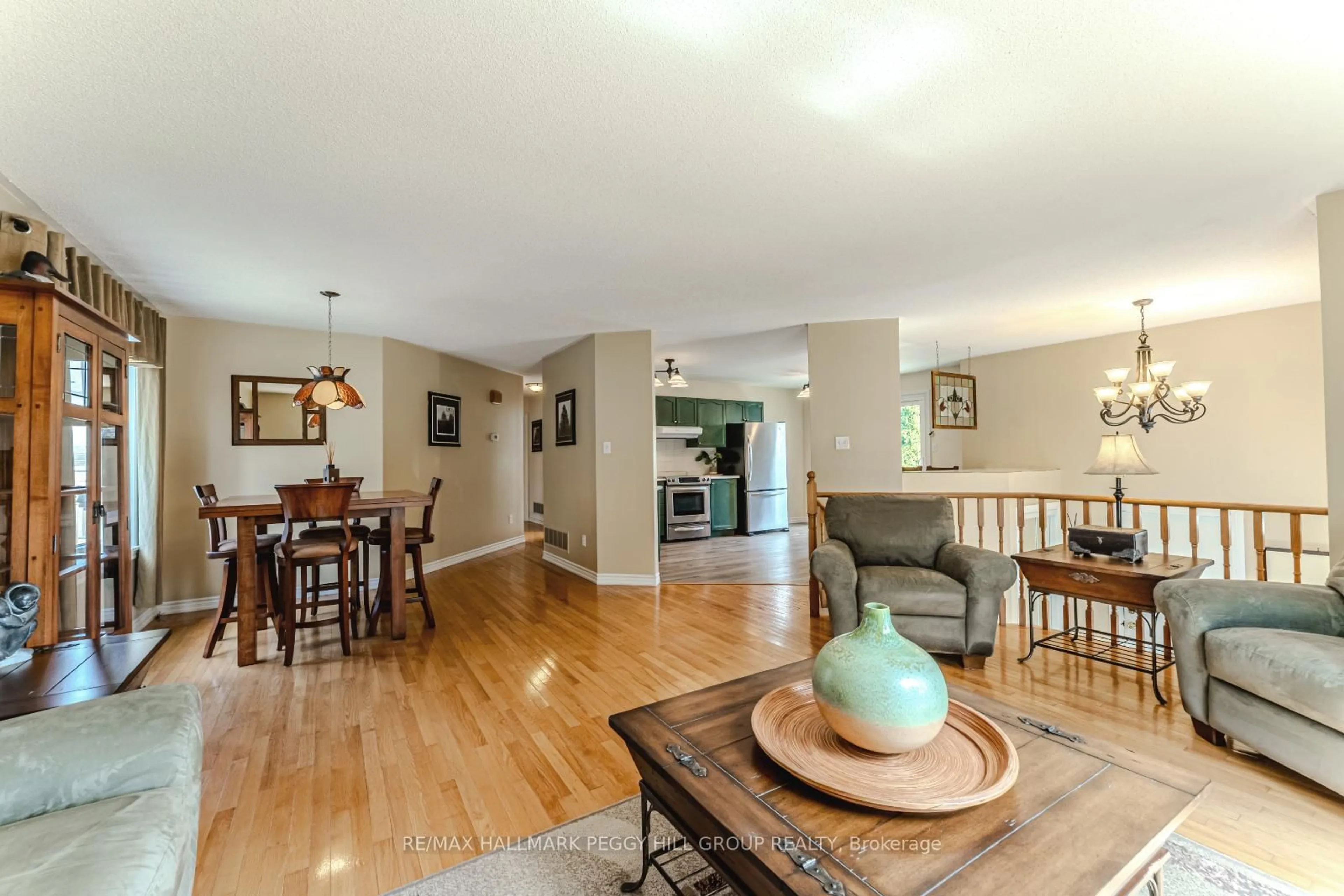 Living room with furniture, wood/laminate floor for 4 Mapleton Ave, Barrie Ontario L4N 7M2