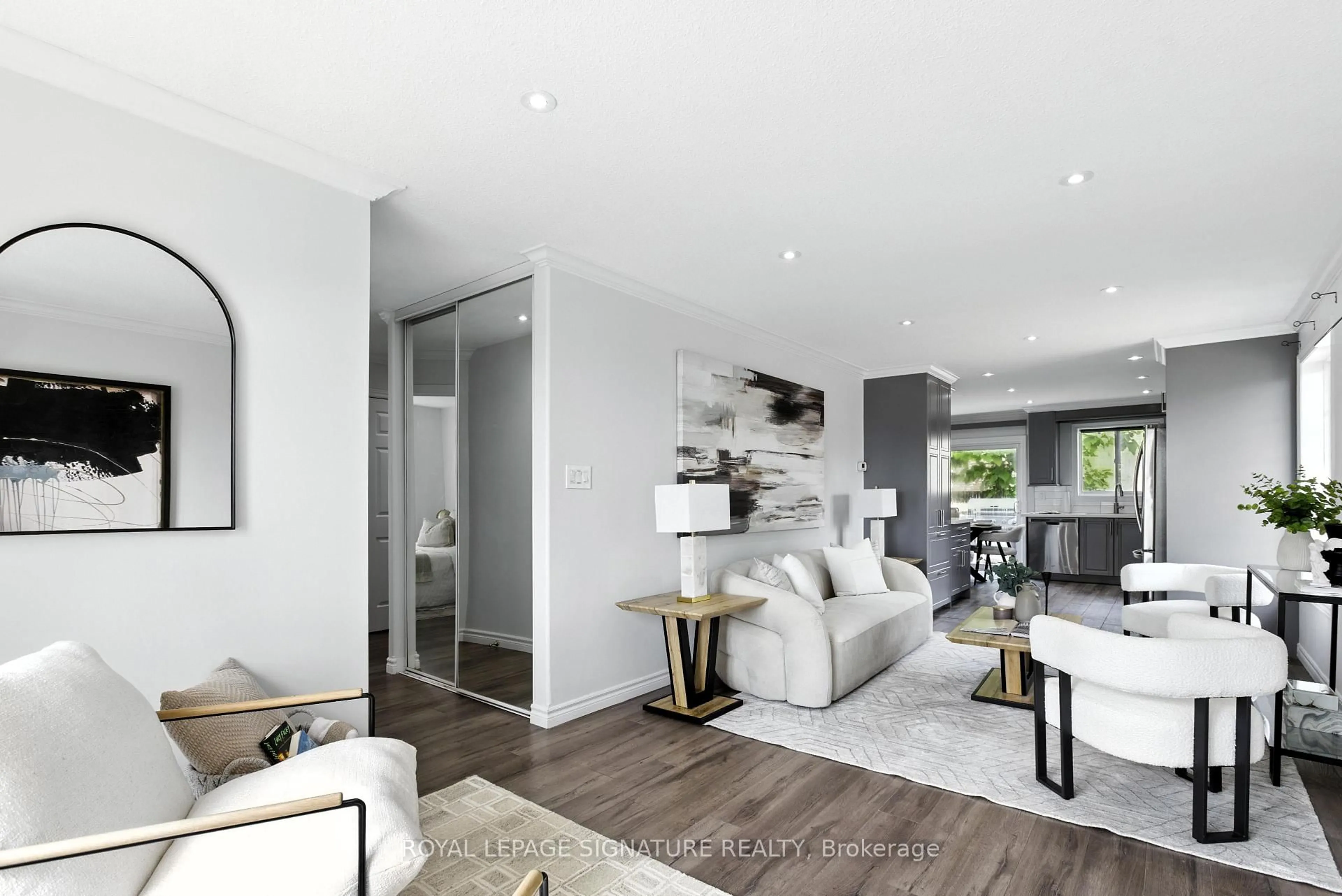 Living room with furniture, wood/laminate floor for 20 Pacific Ave, Barrie Ontario L4M 7E4