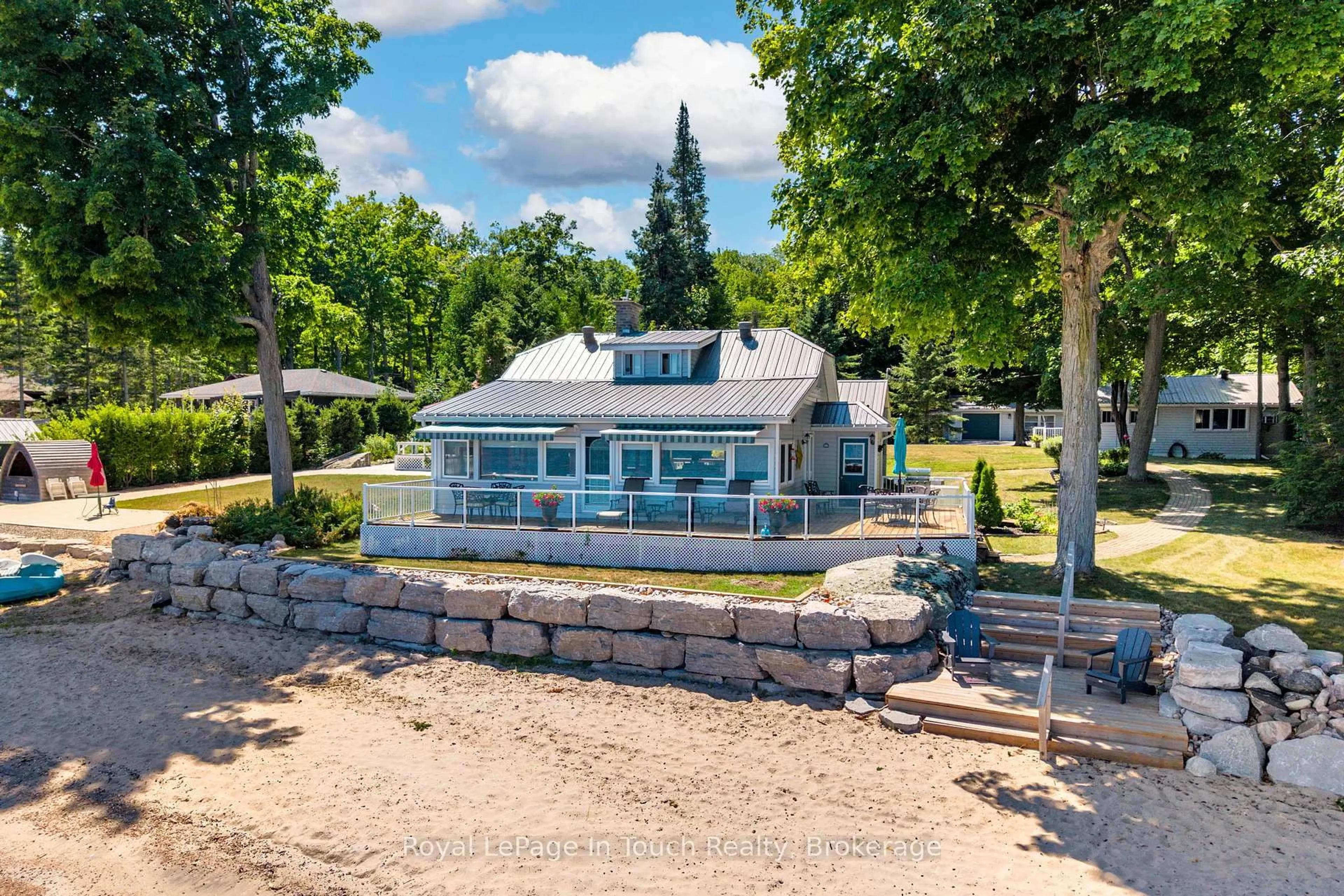 A pic from outside/outdoor area/front of a property/back of a property/a pic from drone, water/lake/river/ocean view for 1443 Champlain Rd, Tiny Ontario L9M 0C1