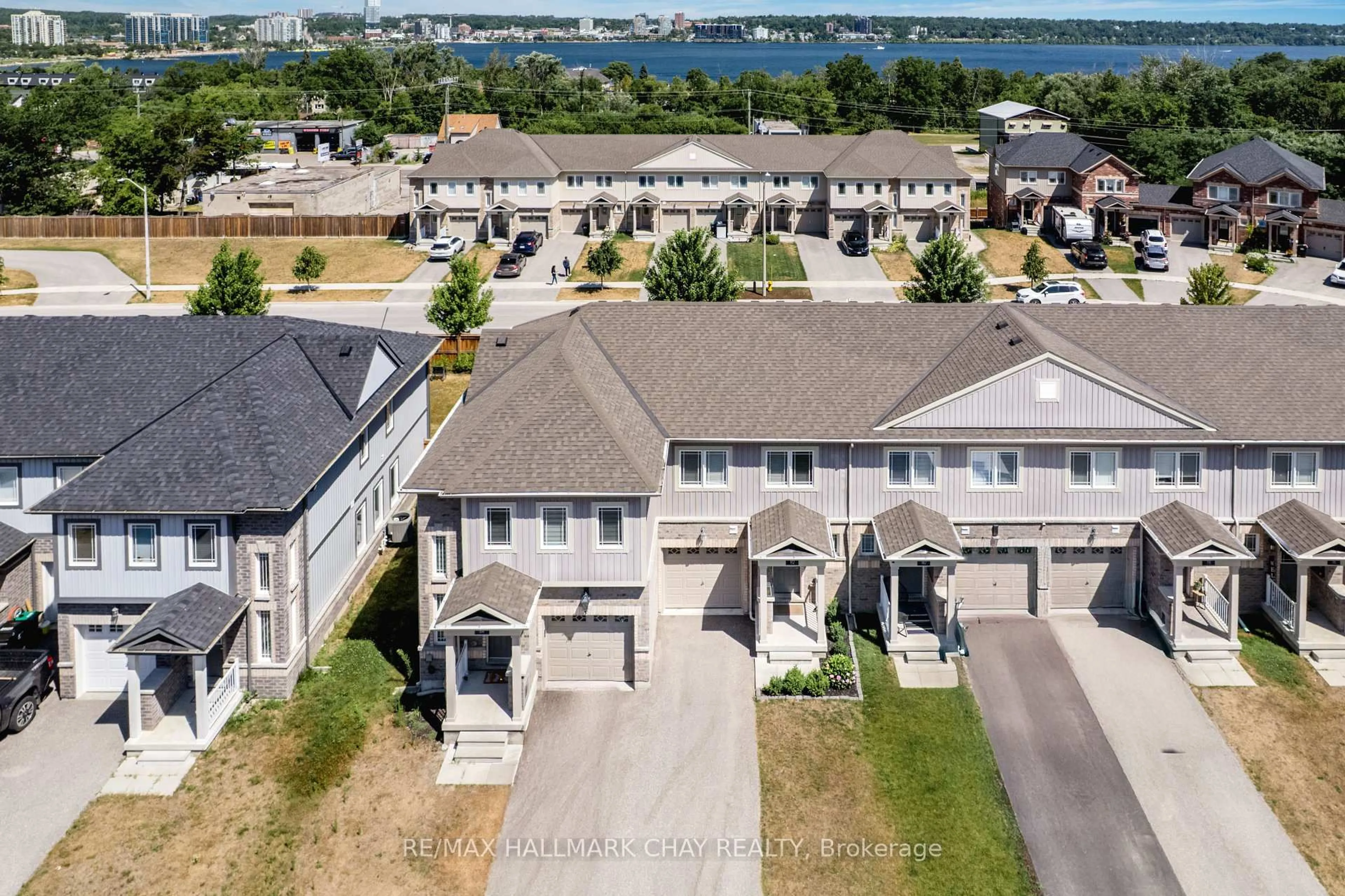 A pic from outside/outdoor area/front of a property/back of a property/a pic from drone, water/lake/river/ocean view for 82 Franks Way, Barrie Ontario L4N 3J1