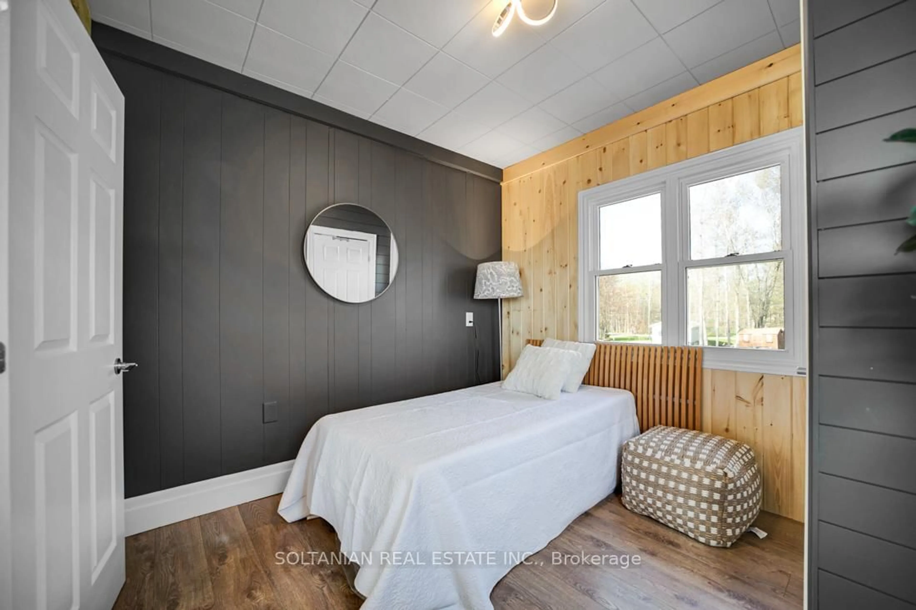 Bedroom with bed, wood/laminate floor for 7260 Glen Ellen Dr, Ramara Ontario L0K 2B0