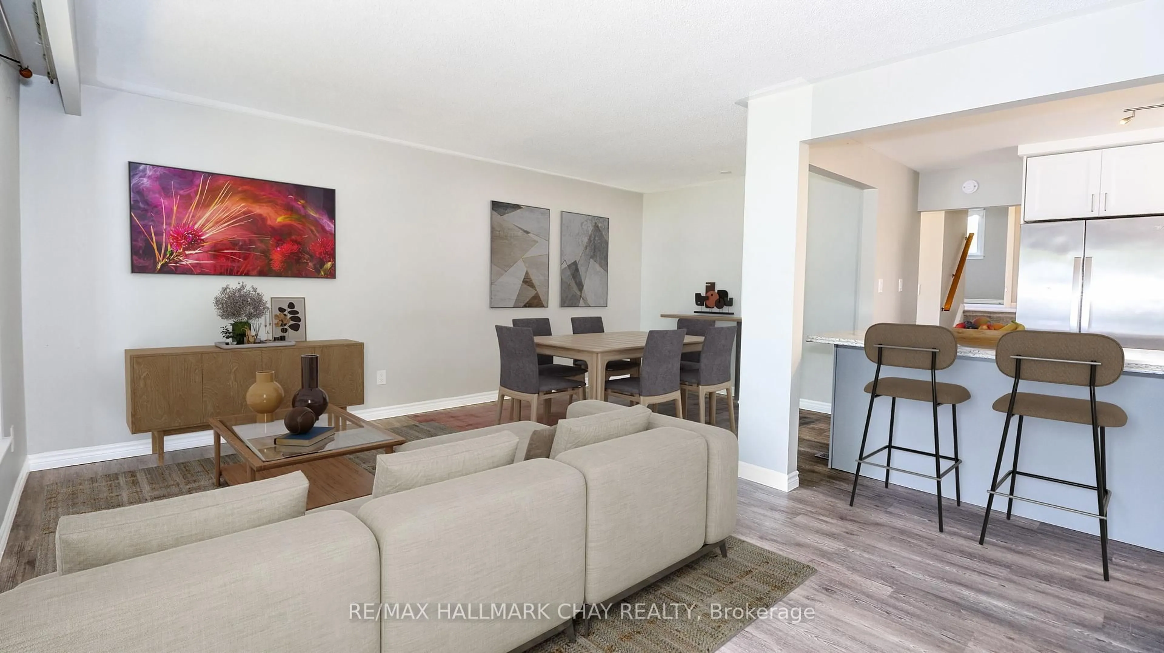 Living room with furniture, wood/laminate floor for 71 Briar Rd, Barrie Ontario L4N 3M5