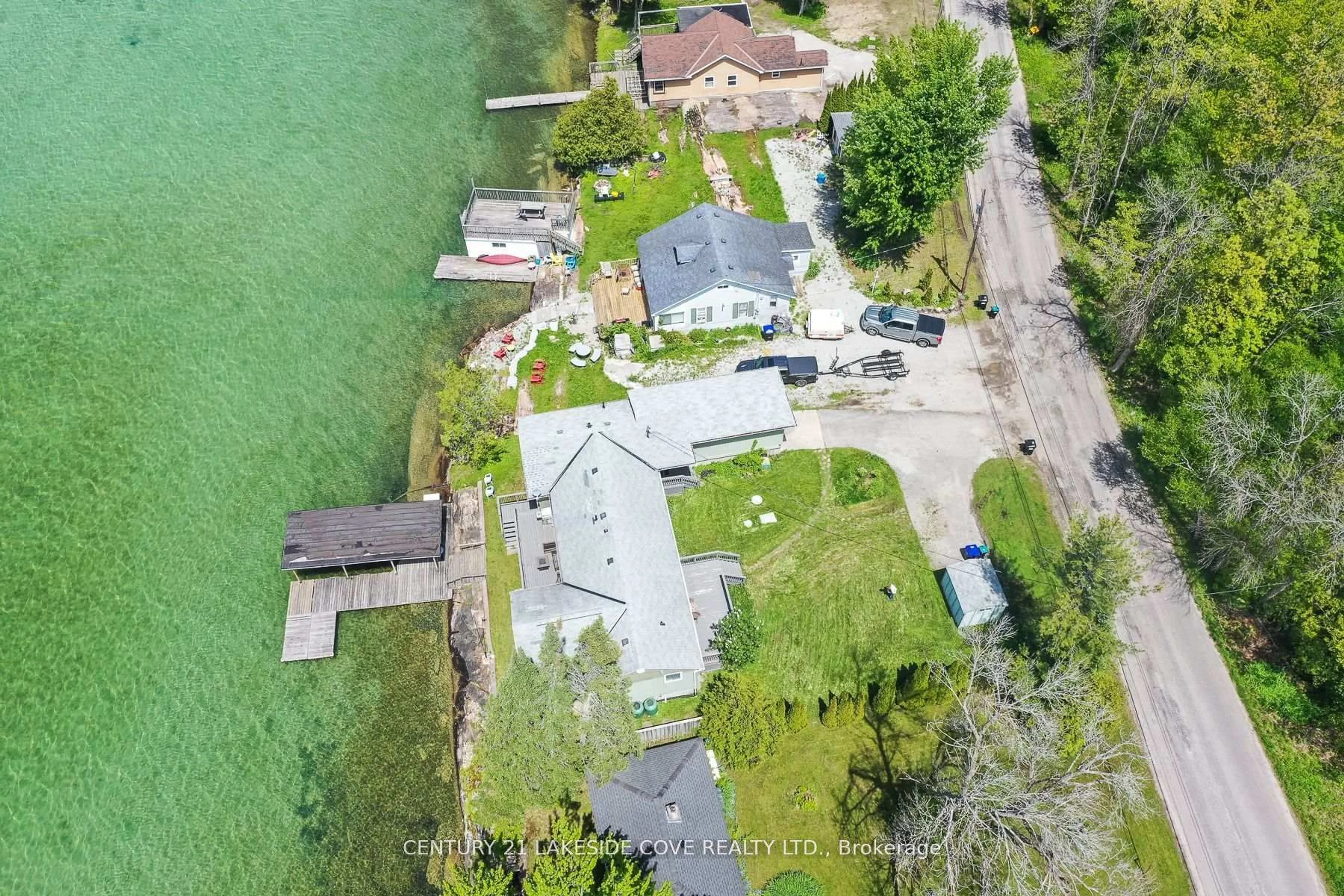 A pic from outside/outdoor area/front of a property/back of a property/a pic from drone, water/lake/river/ocean view for 7712 Oak Point Rd, Ramara Ontario L0K 2B0