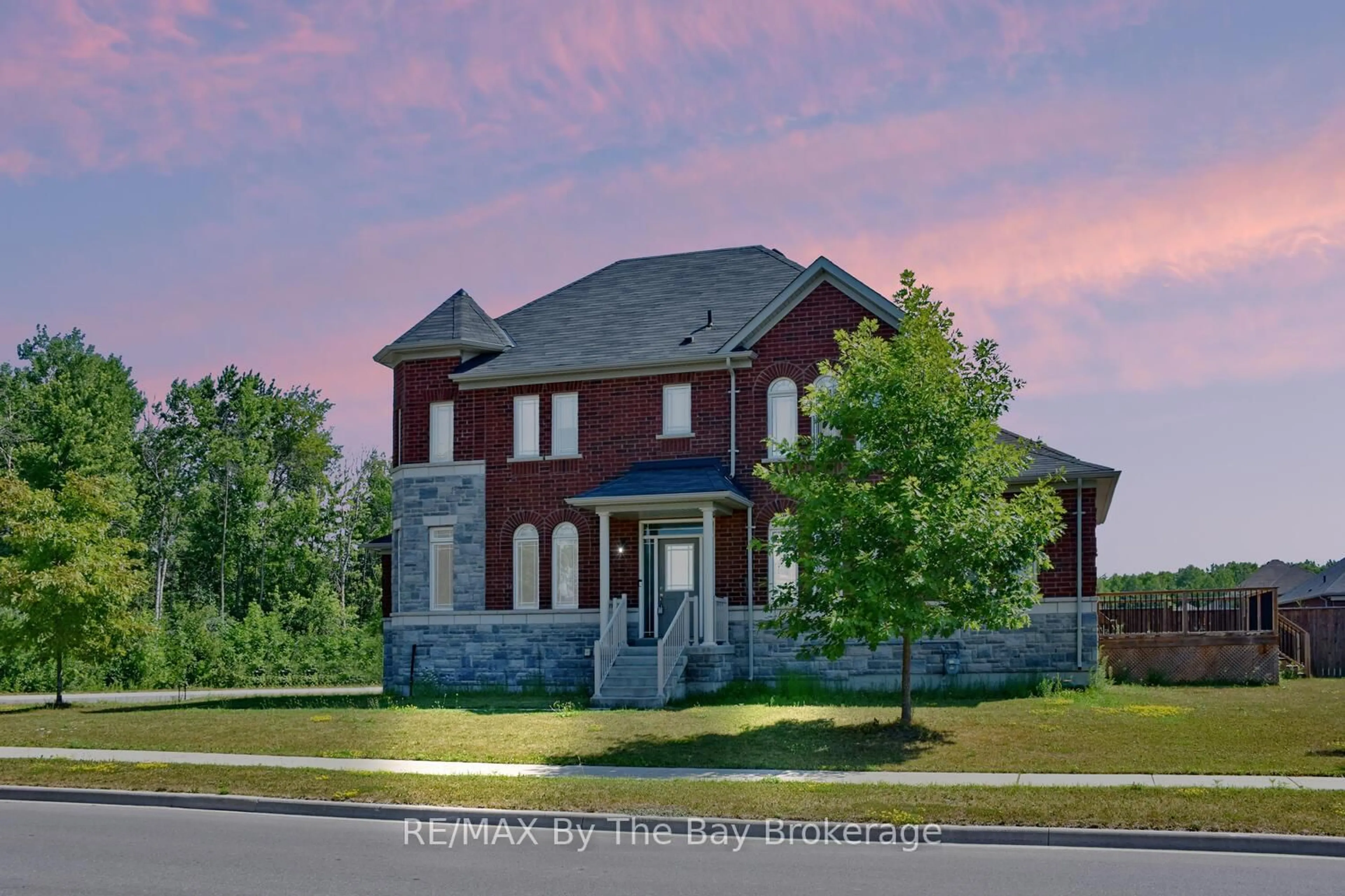 Home with brick exterior material, street for 52 Pearl St, Wasaga Beach Ontario L9Z 0G8