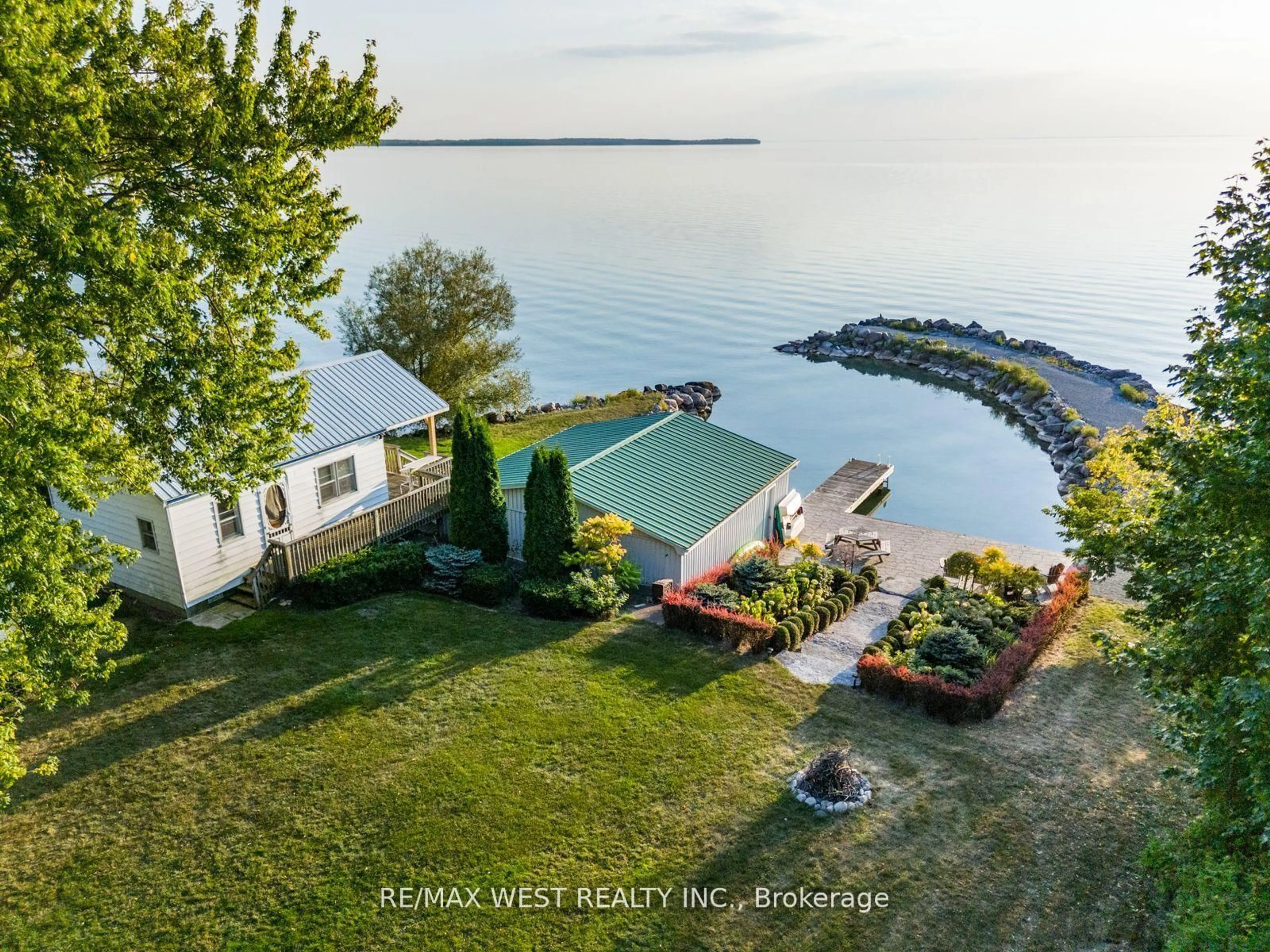 A pic from outside/outdoor area/front of a property/back of a property/a pic from drone, water/lake/river/ocean view for 1668 Lakeshore Dr, Ramara Ontario L0K 1B0