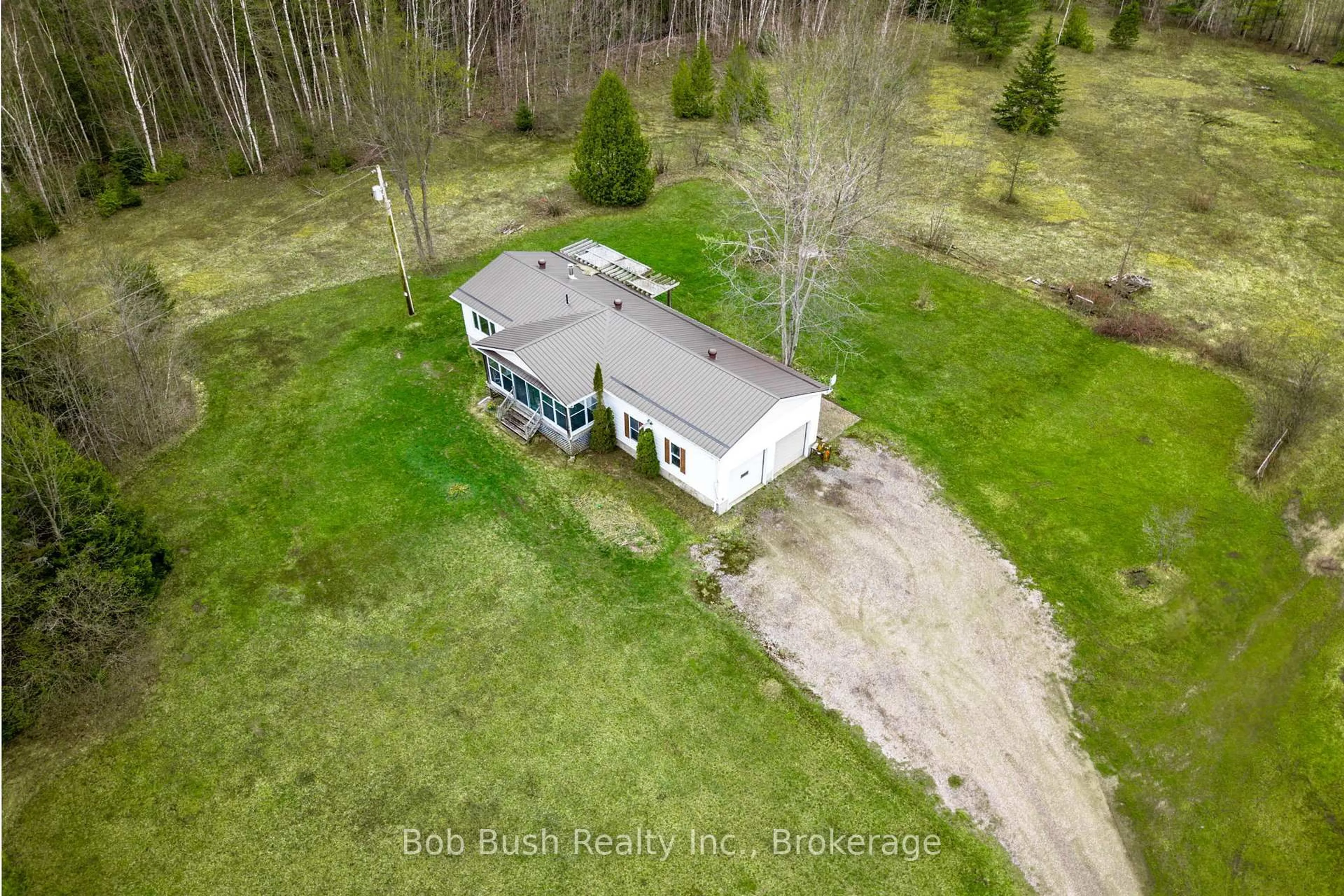 A pic from outside/outdoor area/front of a property/back of a property/a pic from drone, unknown for 10596 12 Highway, Oro-Medonte Ontario L0K 2G0