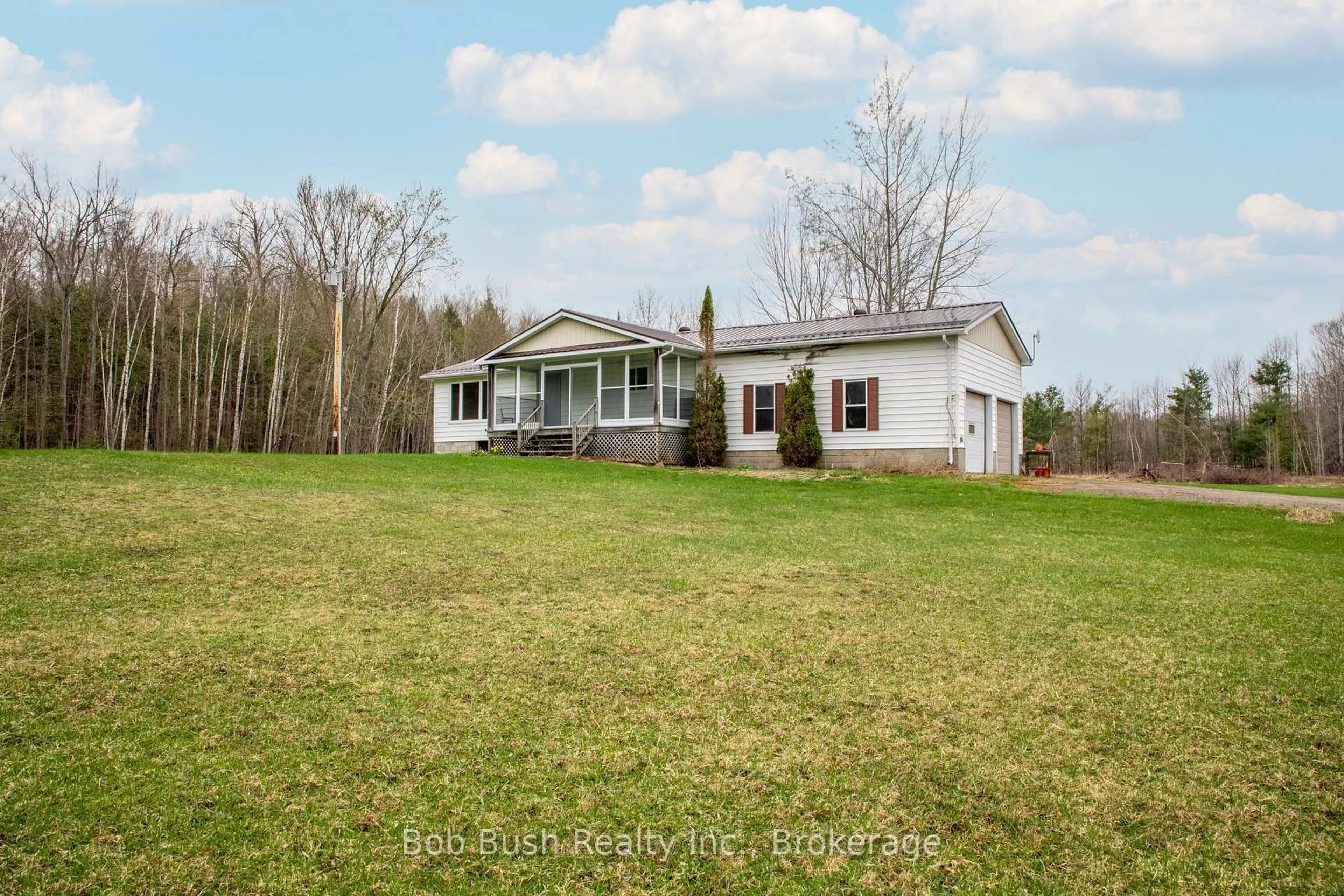 A pic from outside/outdoor area/front of a property/back of a property/a pic from drone, water/lake/river/ocean view for 10596 12 Highway, Oro-Medonte Ontario L0K 2G0