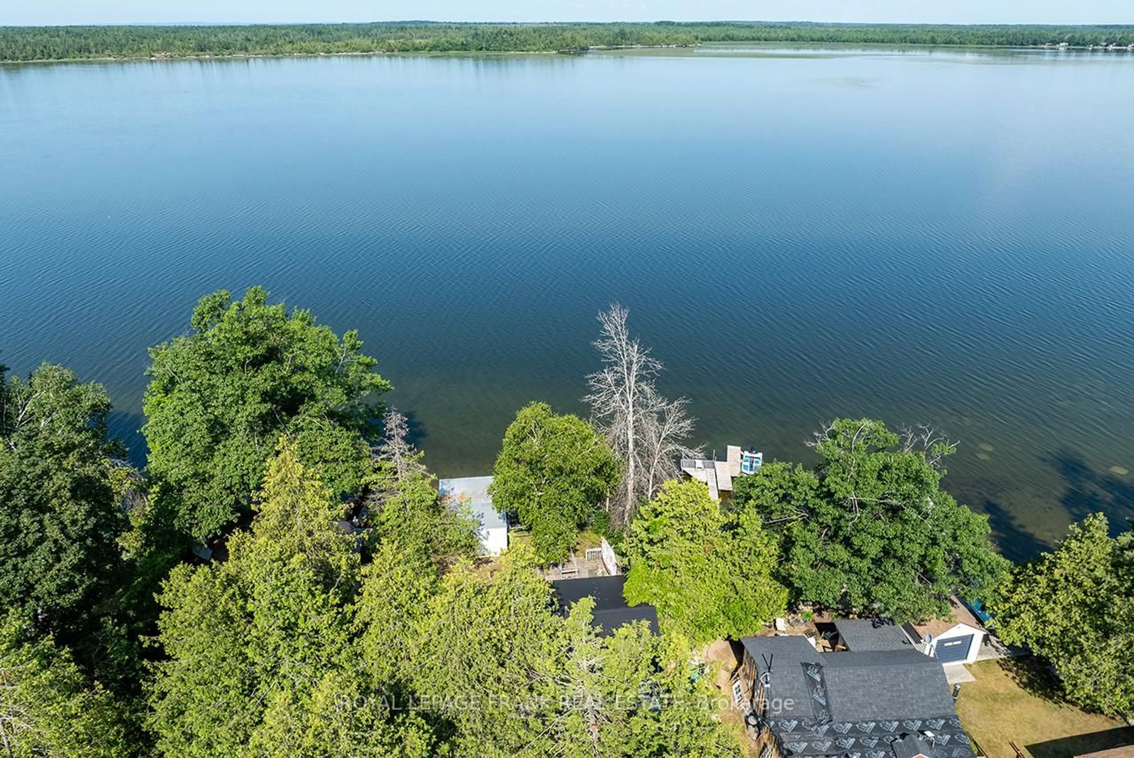 A pic from outside/outdoor area/front of a property/back of a property/a pic from drone, water/lake/river/ocean view for 1206 Black Beach Lane, Ramara Ontario L0K 1B0