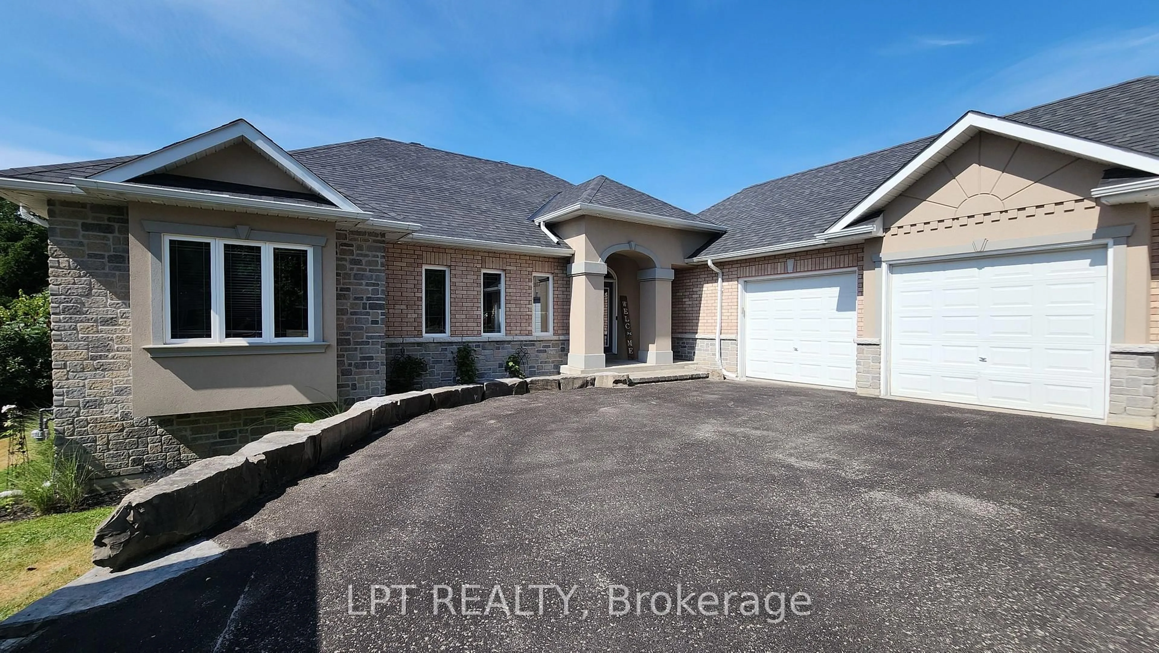 Home with brick exterior material, street for 18 Eder Tr, Springwater Ontario L0L 1Y3