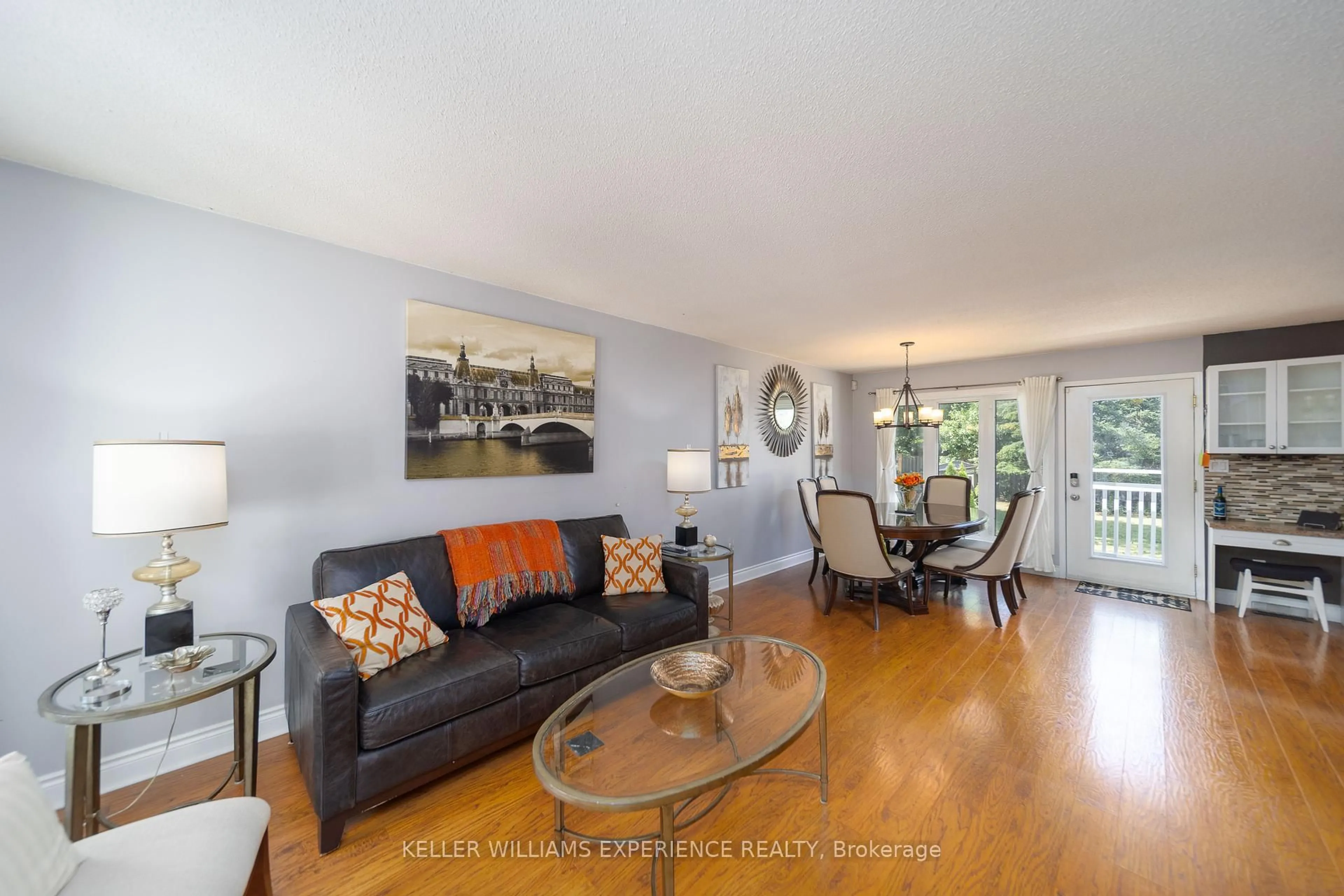 Living room with furniture, wood/laminate floor for 86 Donald St, Barrie Ontario L4N 1E3