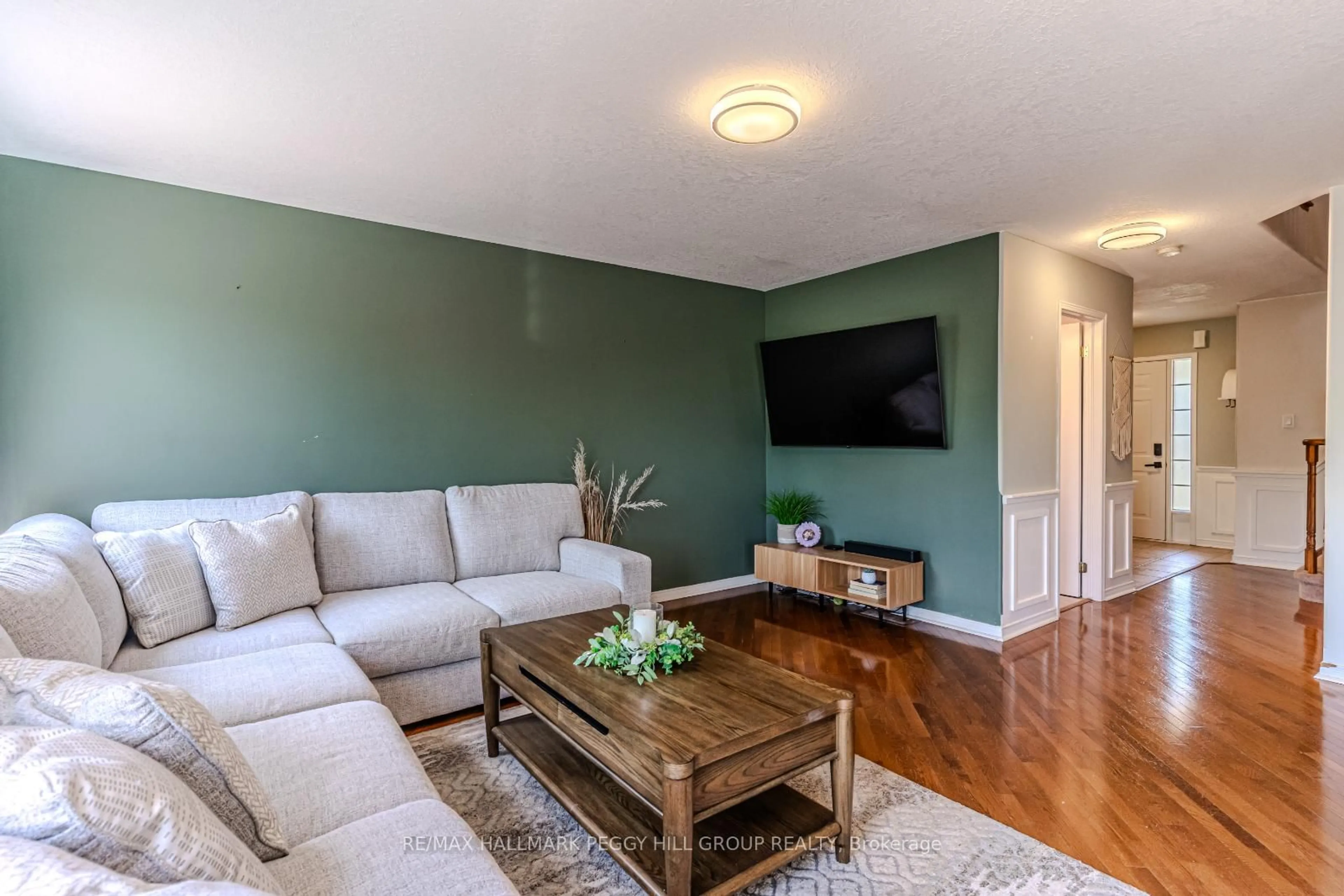 Living room with furniture, wood/laminate floor for 3165 Bass Lake Sdrd, Orillia Ontario L3V 7Y7
