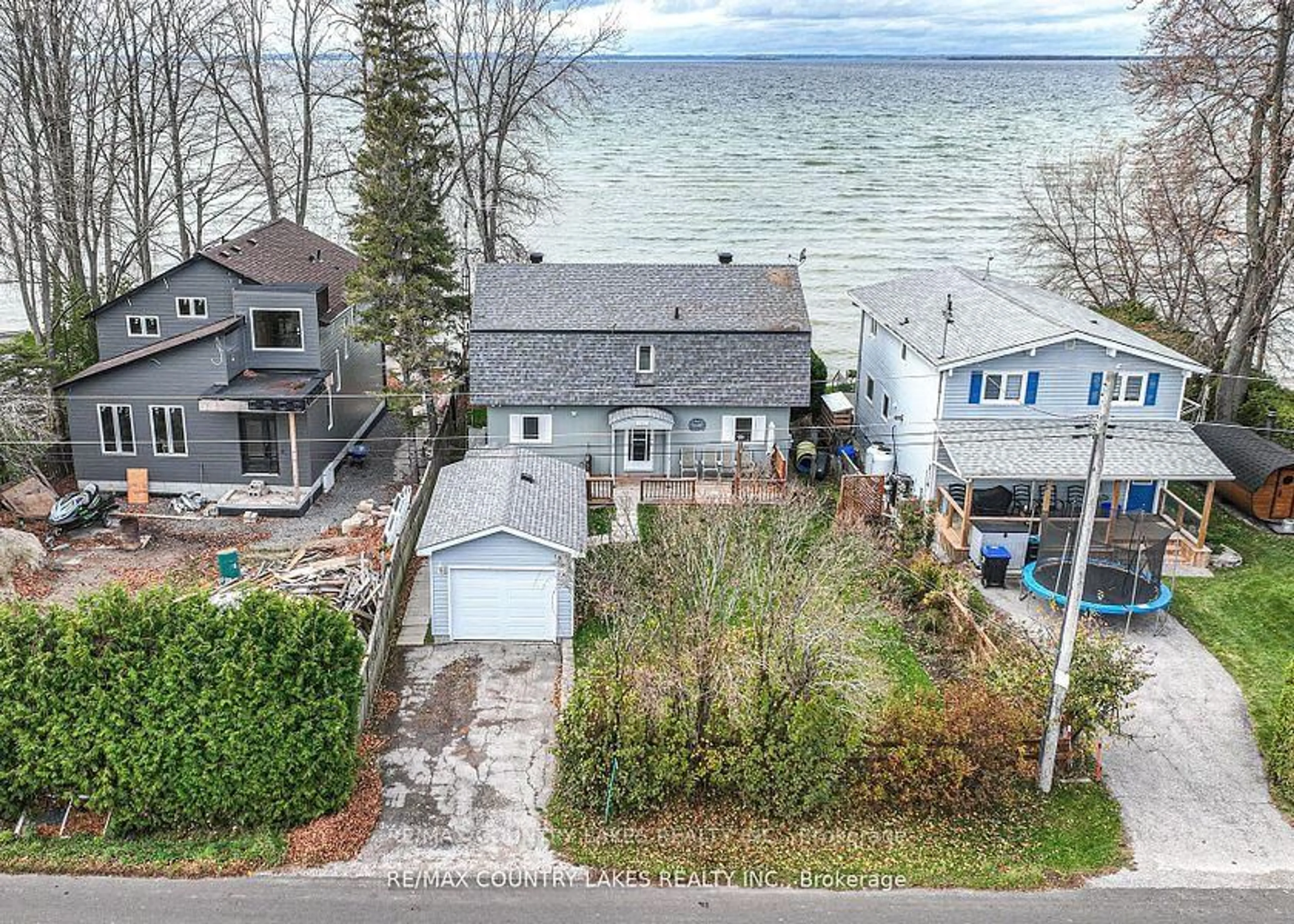 A pic from outside/outdoor area/front of a property/back of a property/a pic from drone, water/lake/river/ocean view for 2102 Lakeshore Dr, Ramara Ontario L0K 1B0