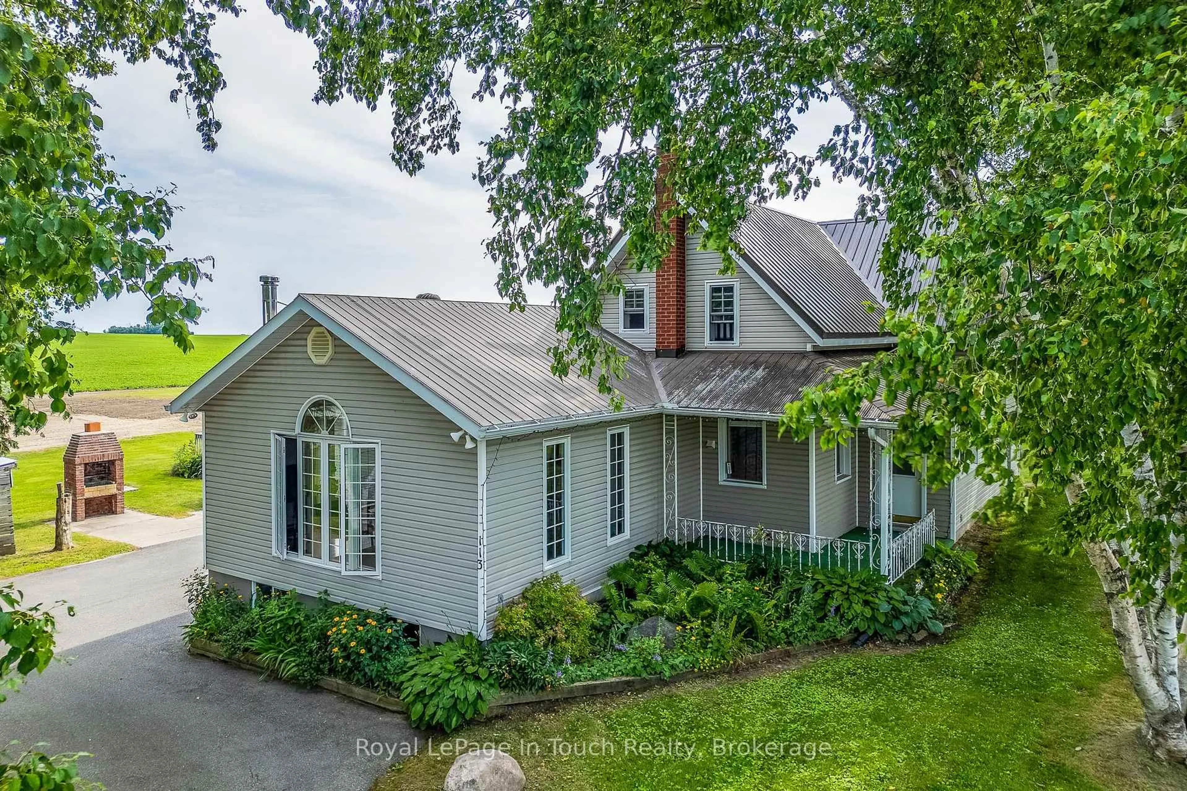 A pic from outside/outdoor area/front of a property/back of a property/a pic from drone, street for 113 Concession 17 Rd, Tiny Ontario L9M 0P4