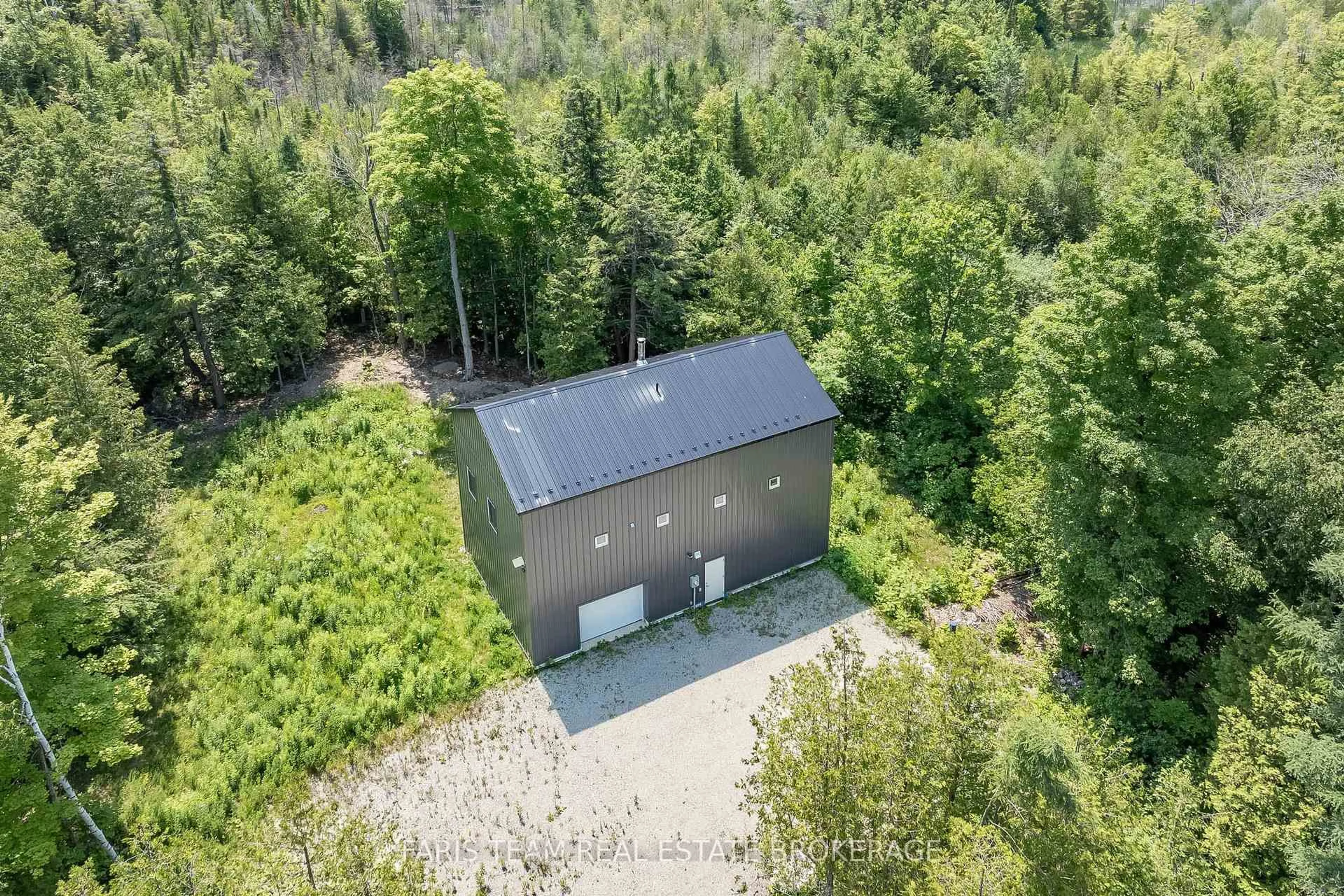 A pic from outside/outdoor area/front of a property/back of a property/a pic from drone, forest/trees view for 2576 Champlain Rd, Tiny Ontario L9M 0C9