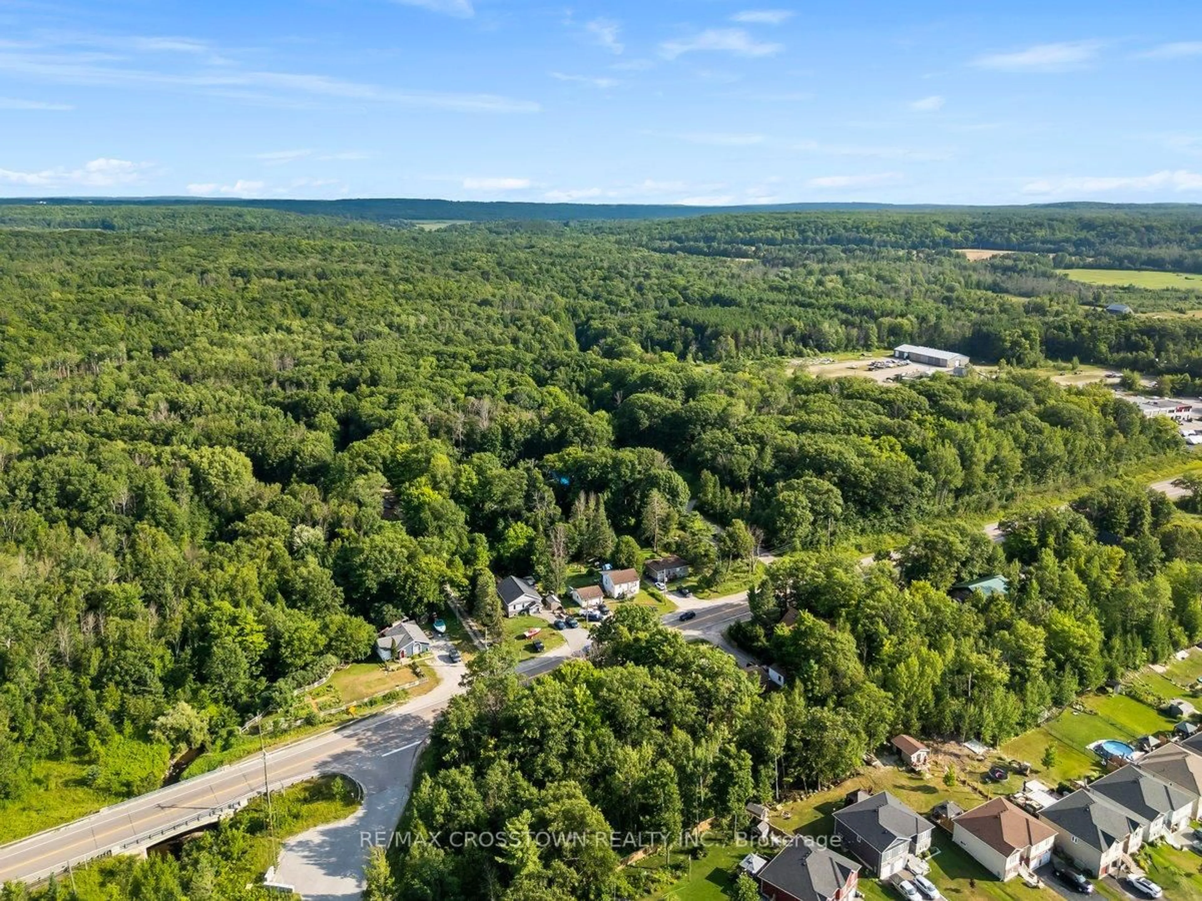 A pic from outside/outdoor area/front of a property/back of a property/a pic from drone, forest/trees view for 15205 Highway 12, Tay Ontario 00000