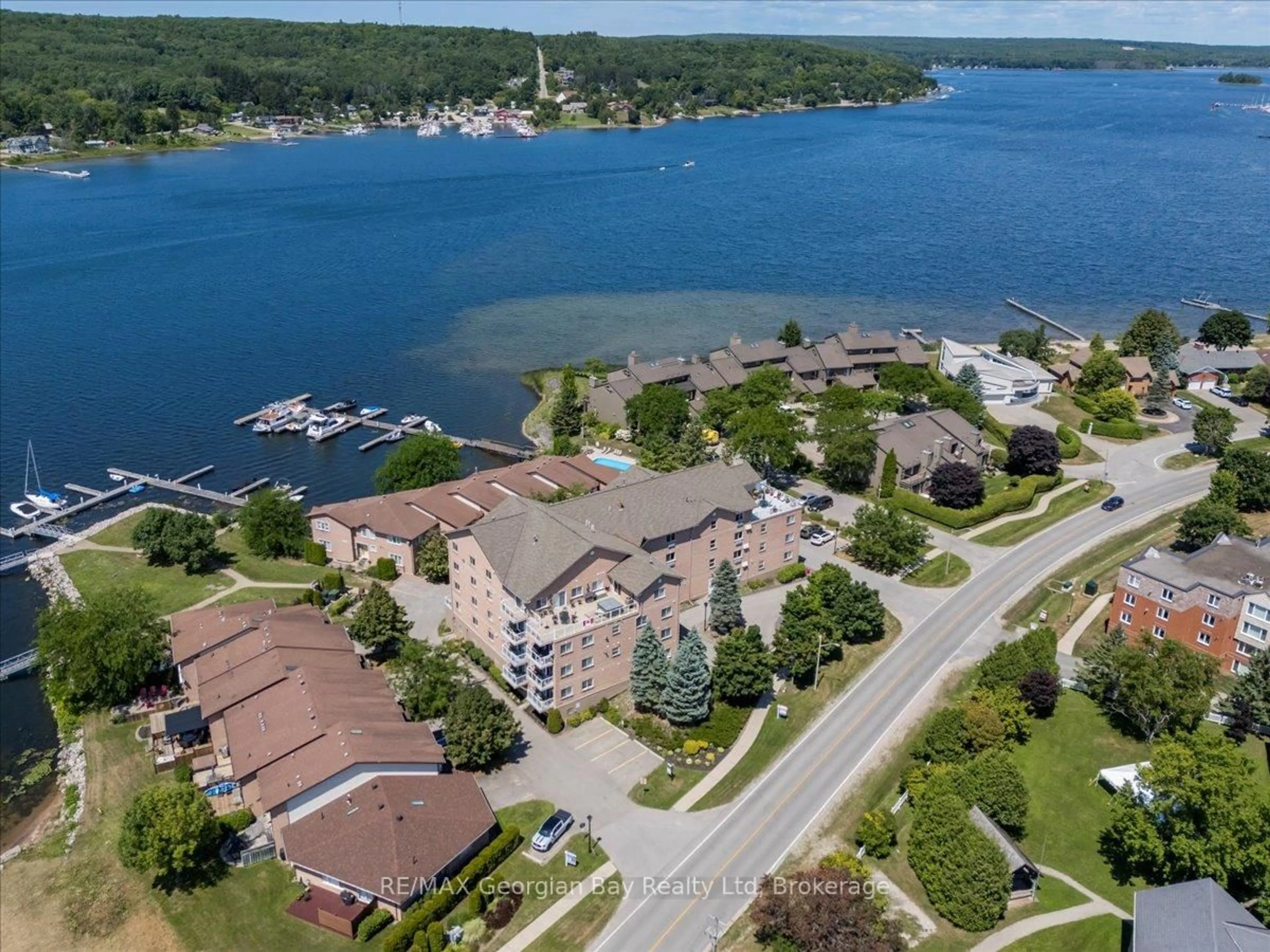 A pic from outside/outdoor area/front of a property/back of a property/a pic from drone, water/lake/river/ocean view for 4 Beck Blvd #201, Penetanguishene Ontario L9M 2H3