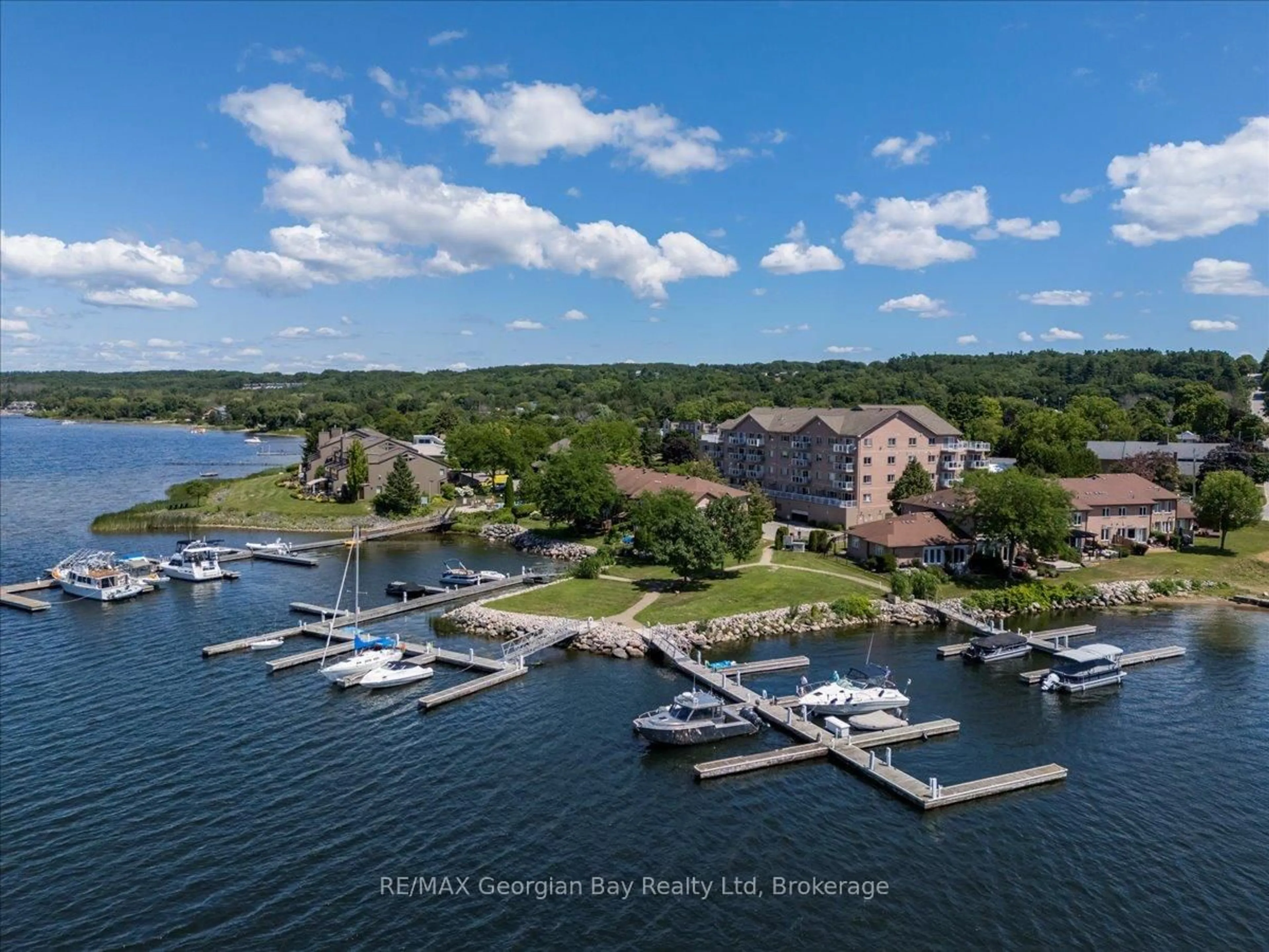 A pic from outside/outdoor area/front of a property/back of a property/a pic from drone, water/lake/river/ocean view for 4 Beck Blvd #201, Penetanguishene Ontario L9M 2H3