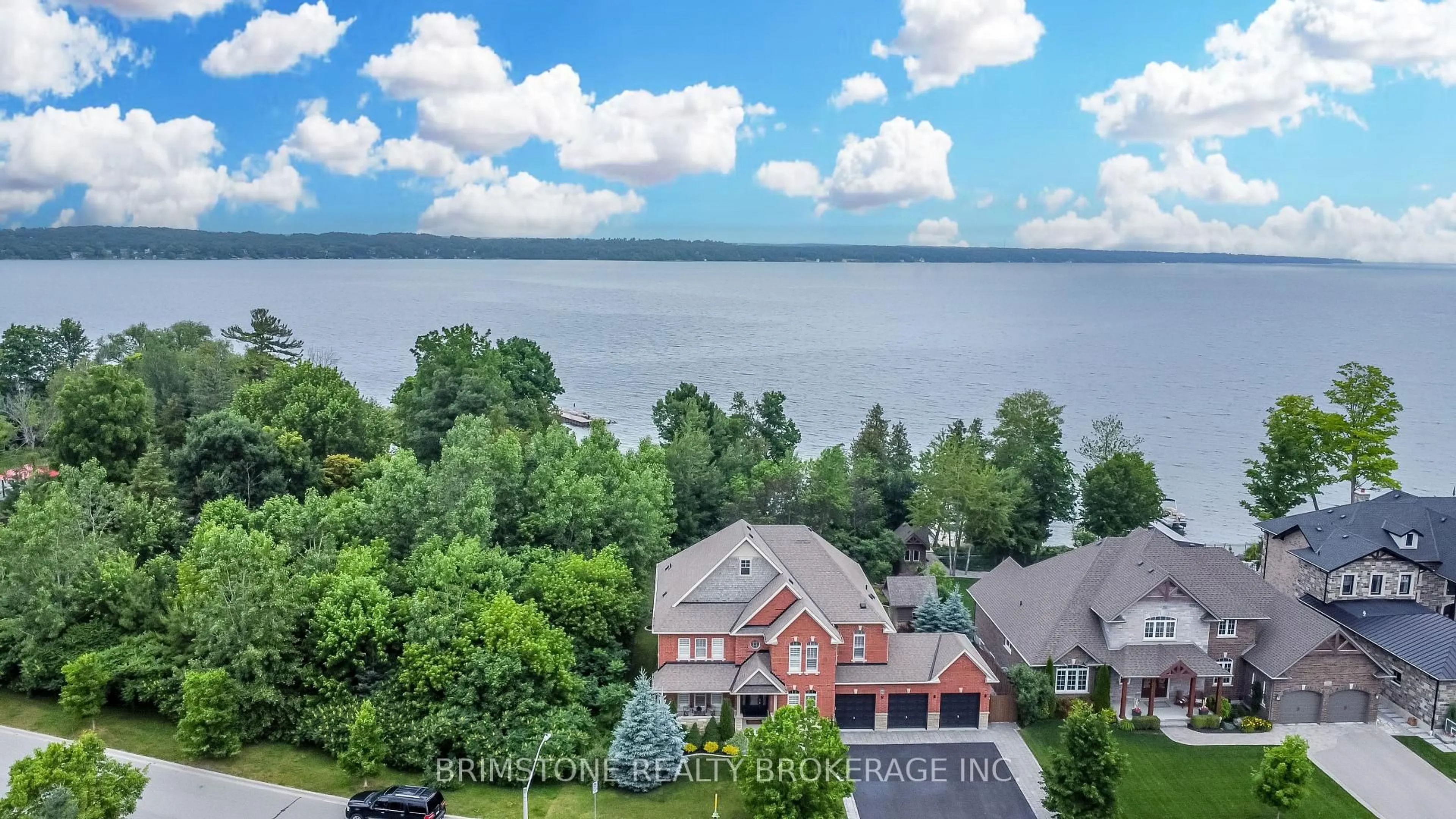 A pic from outside/outdoor area/front of a property/back of a property/a pic from drone, water/lake/river/ocean view for 31 Plunkett Crt, Barrie Ontario L4N 6M3