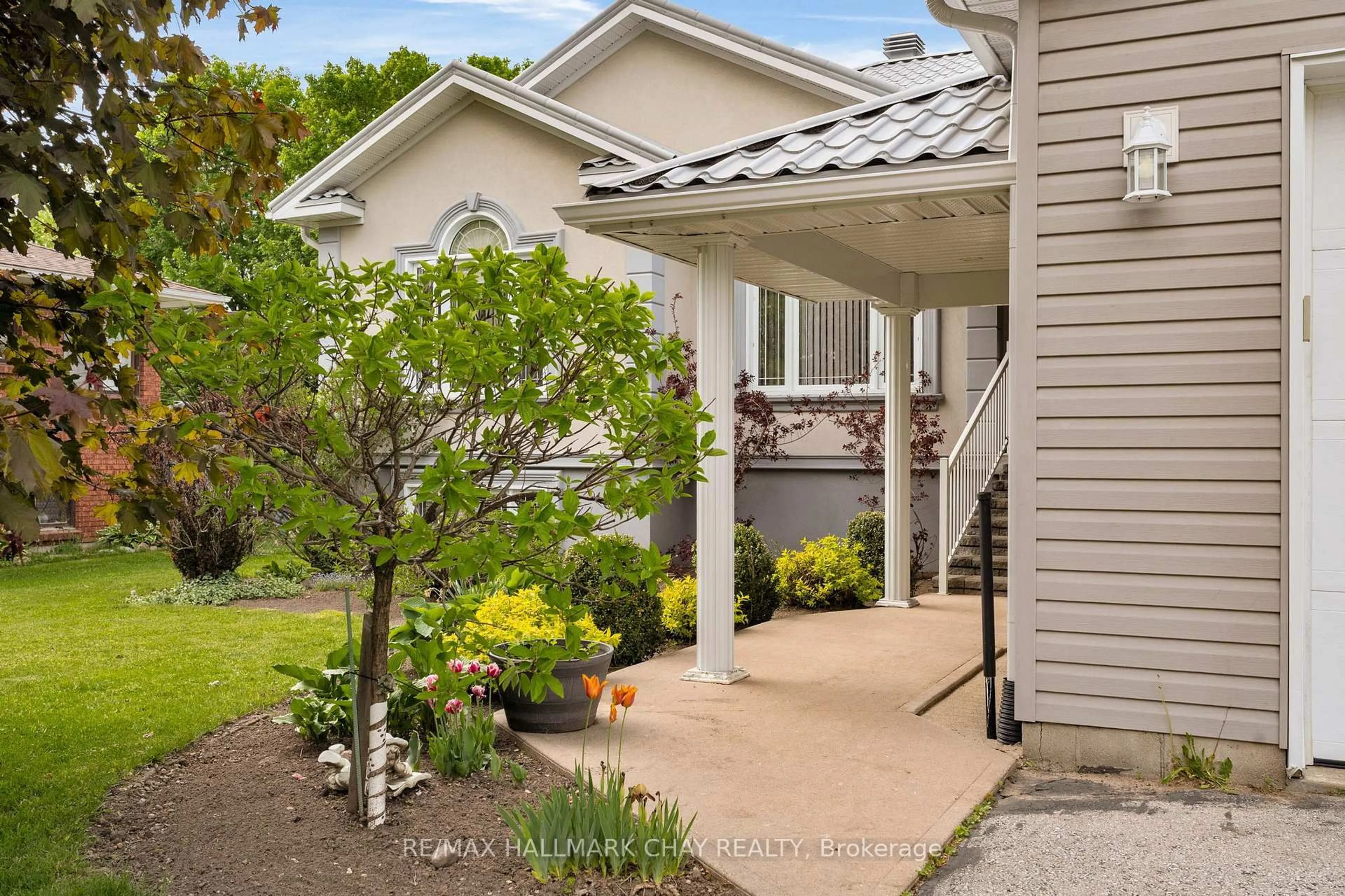 Home with vinyl exterior material, street for 24 MCKENZIE St, Tiny Ontario L0L 2T0