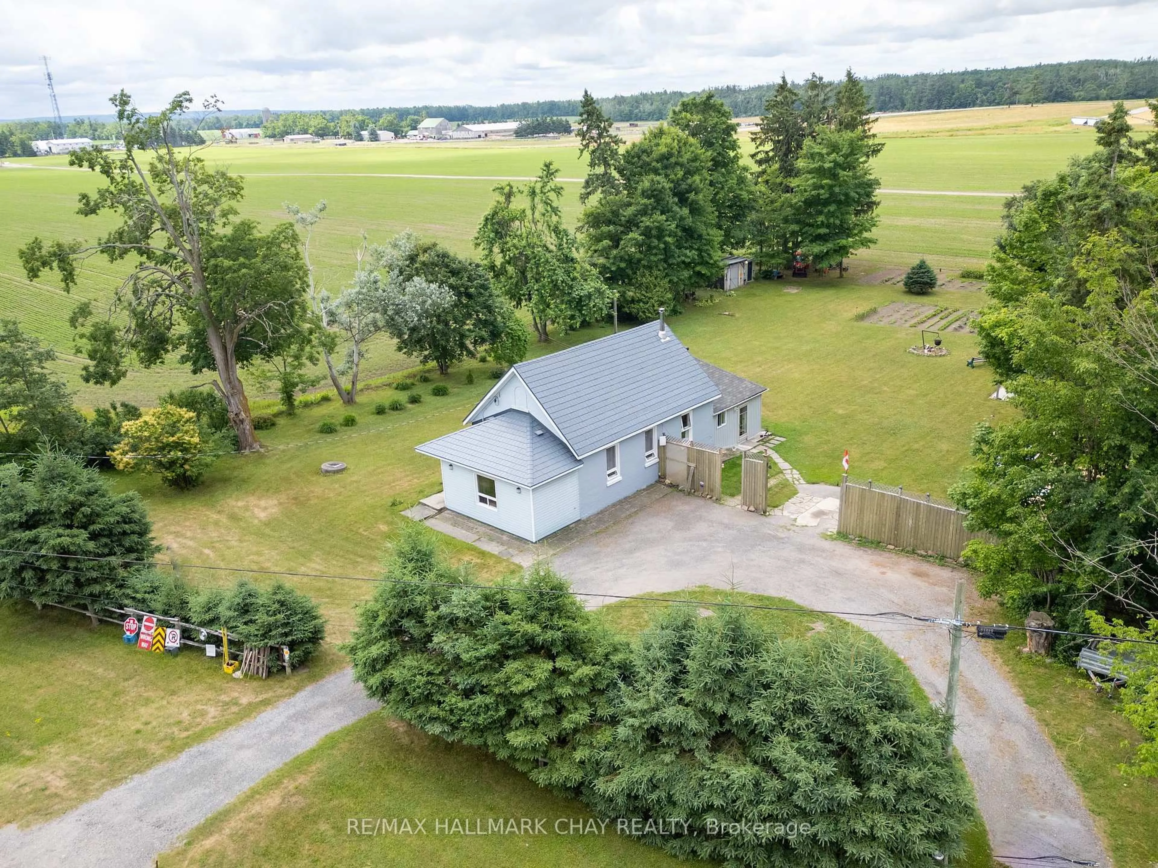 A pic from outside/outdoor area/front of a property/back of a property/a pic from drone, unknown for 12968 County 27 Rd, Springwater Ontario L0L 2K0