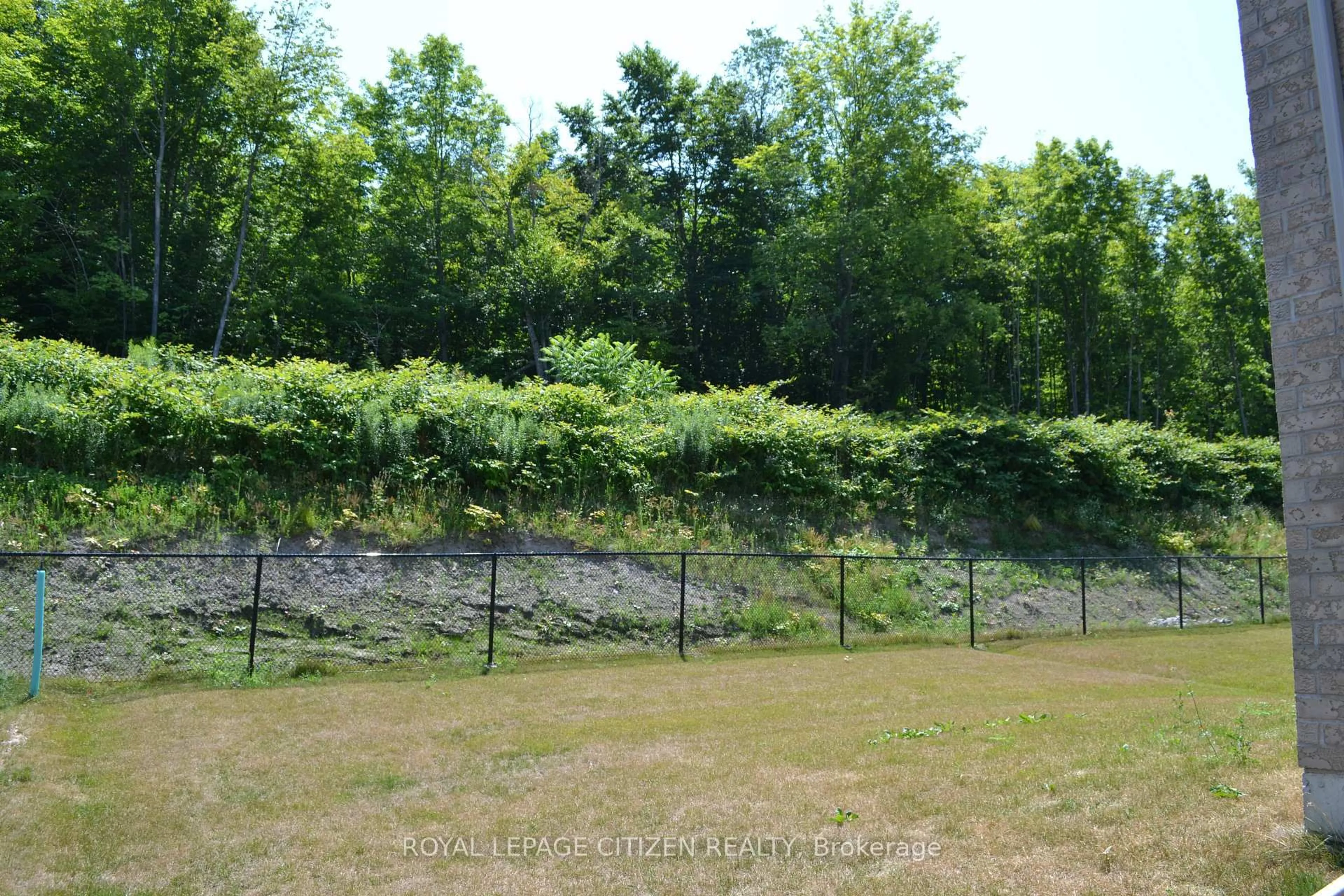 A pic from outside/outdoor area/front of a property/back of a property/a pic from drone, forest/trees view for 13 Revol Rd, Penetanguishene Ontario L9M 0W8