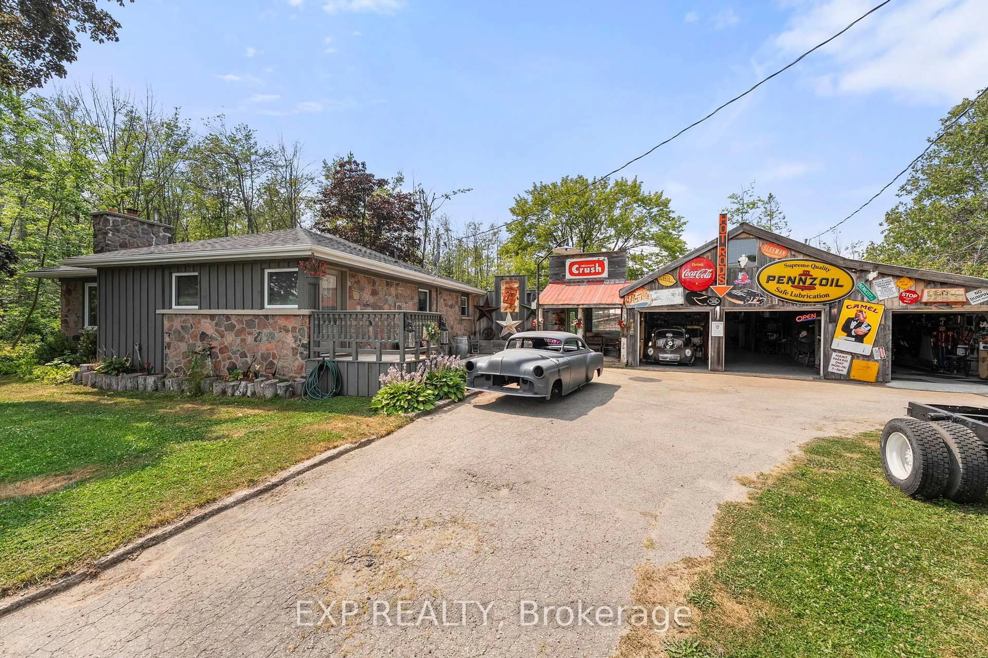 A pic from outside/outdoor area/front of a property/back of a property/a pic from drone, street for 5514 Highway 11 South, R R 1, Oro-Medonte Ontario L3V 8H2