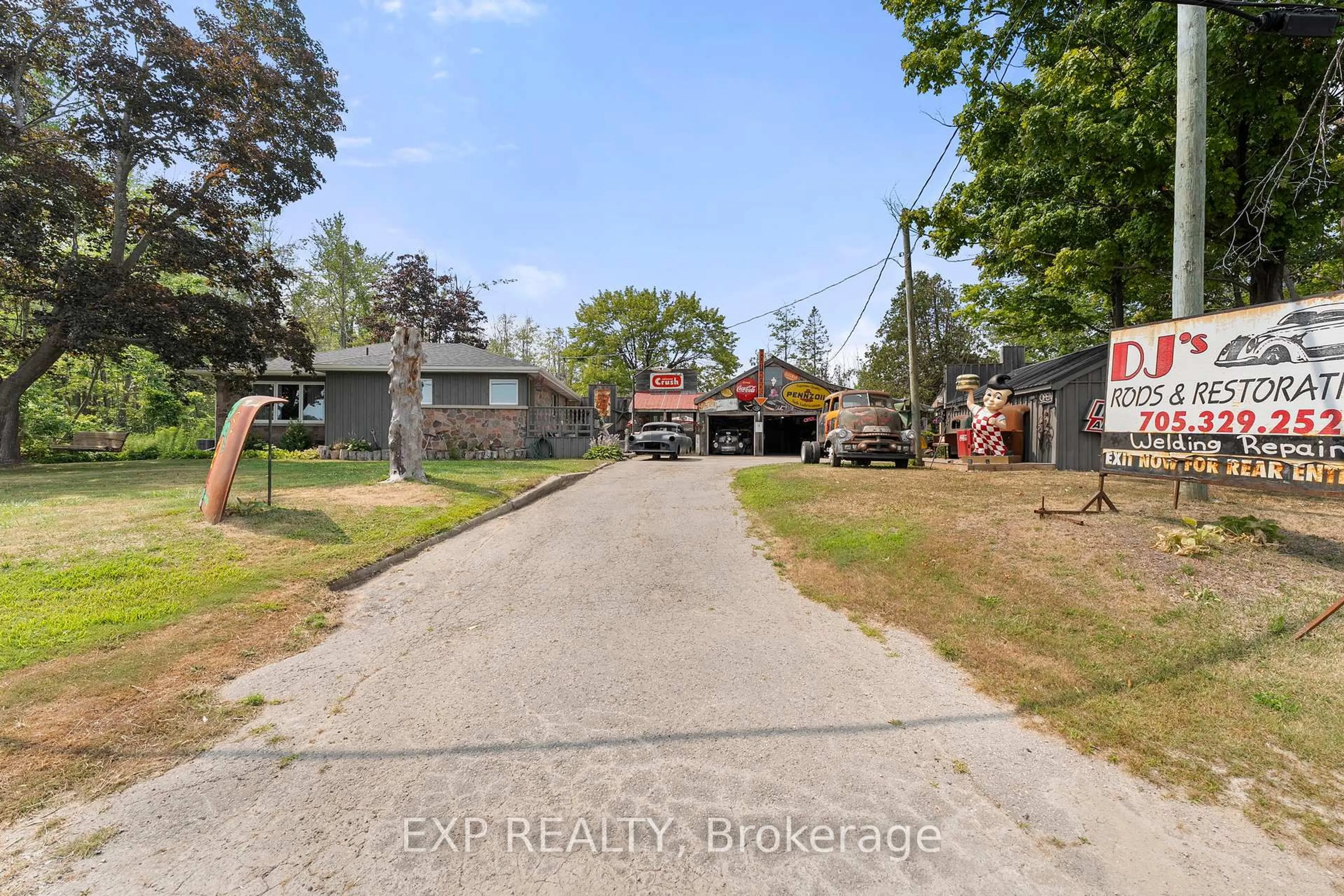A pic from outside/outdoor area/front of a property/back of a property/a pic from drone, street for 5514 Highway 11 South, R R 1, Oro-Medonte Ontario L3V 8H2