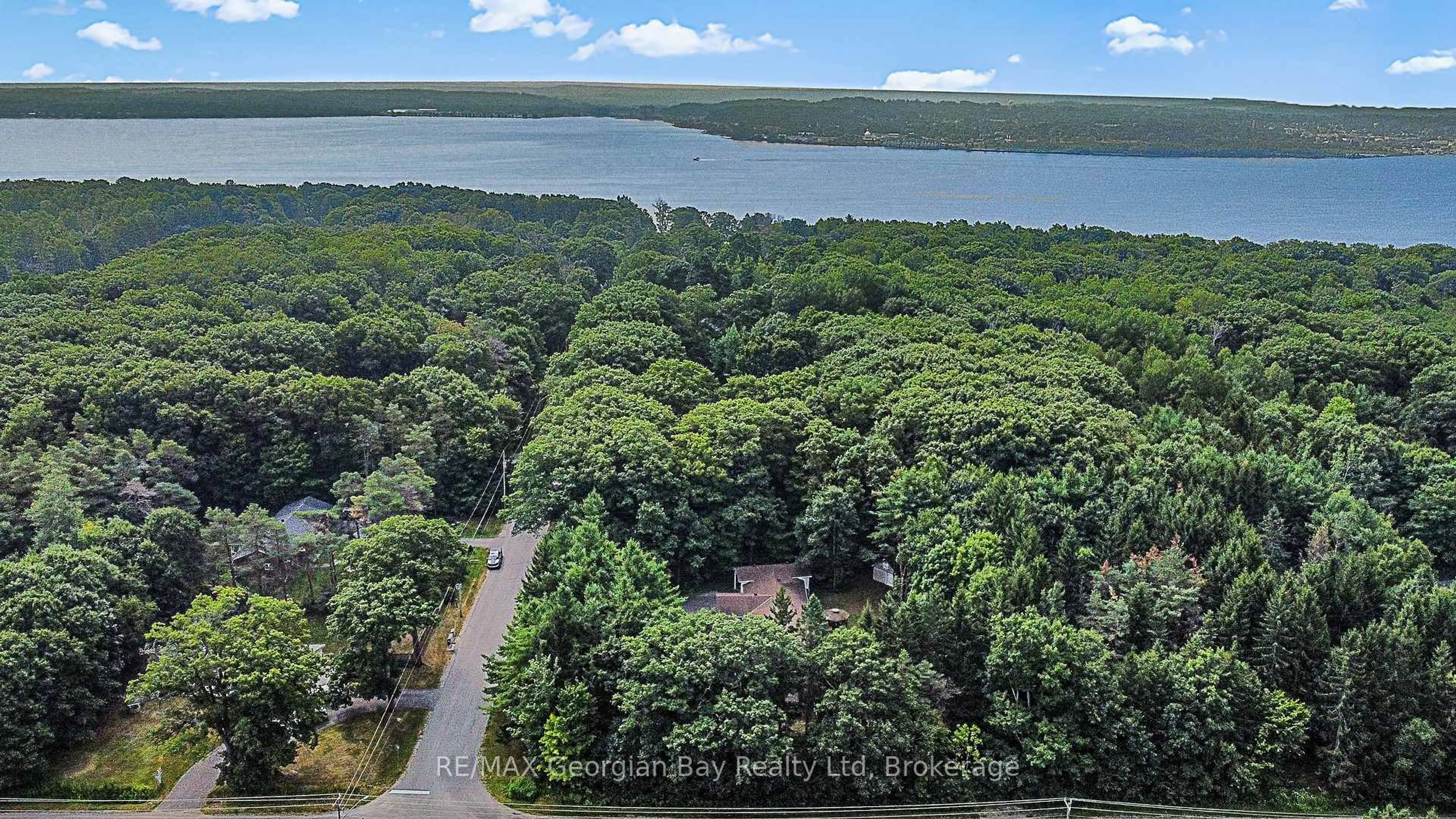 A pic from outside/outdoor area/front of a property/back of a property/a pic from drone, water/lake/river/ocean view for 436 Puddicombe Rd, Midland Ontario L4R 5G7
