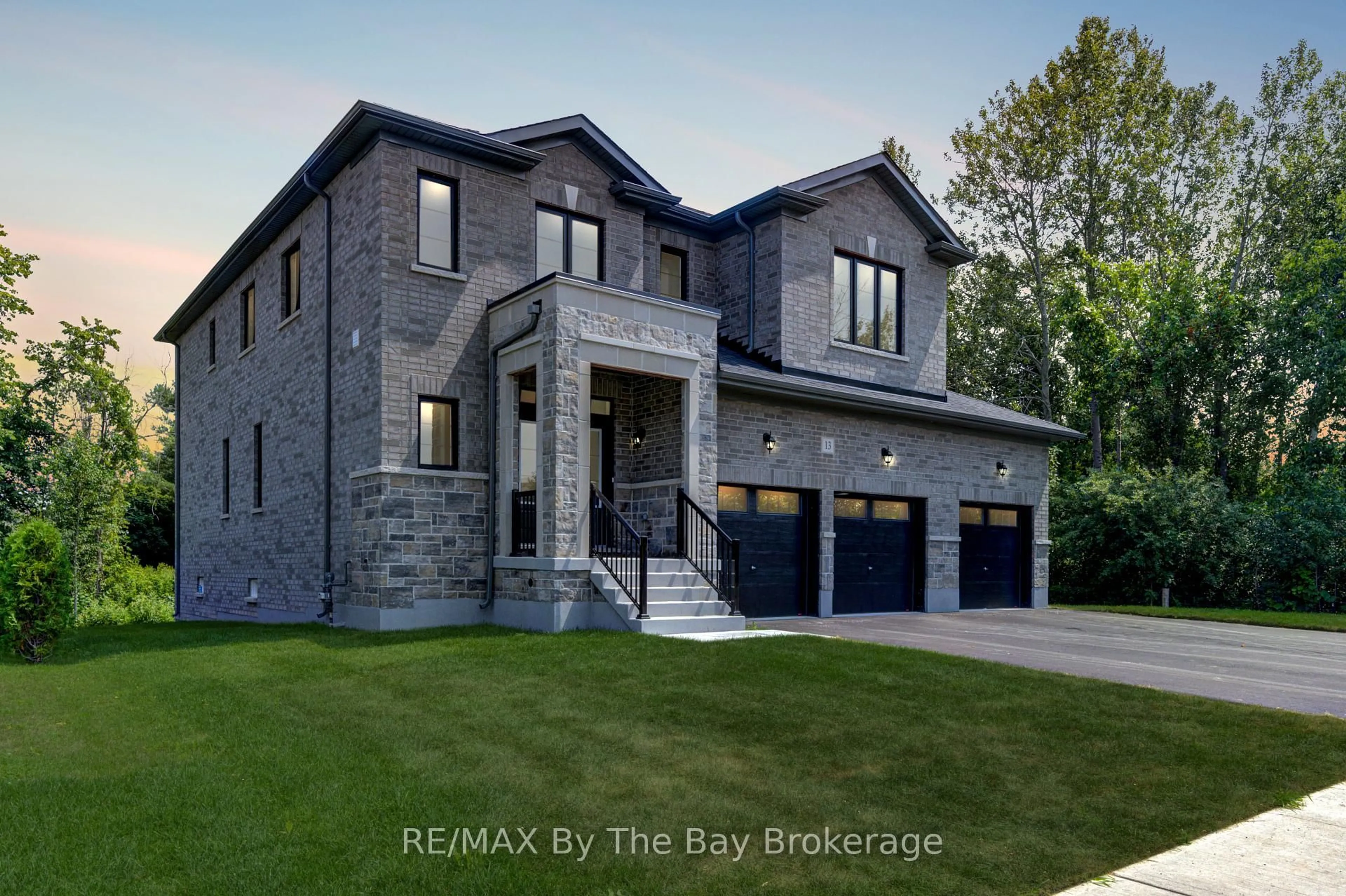 Home with brick exterior material, street for 13 Emerald St, Wasaga Beach Ontario L9Z 2N5