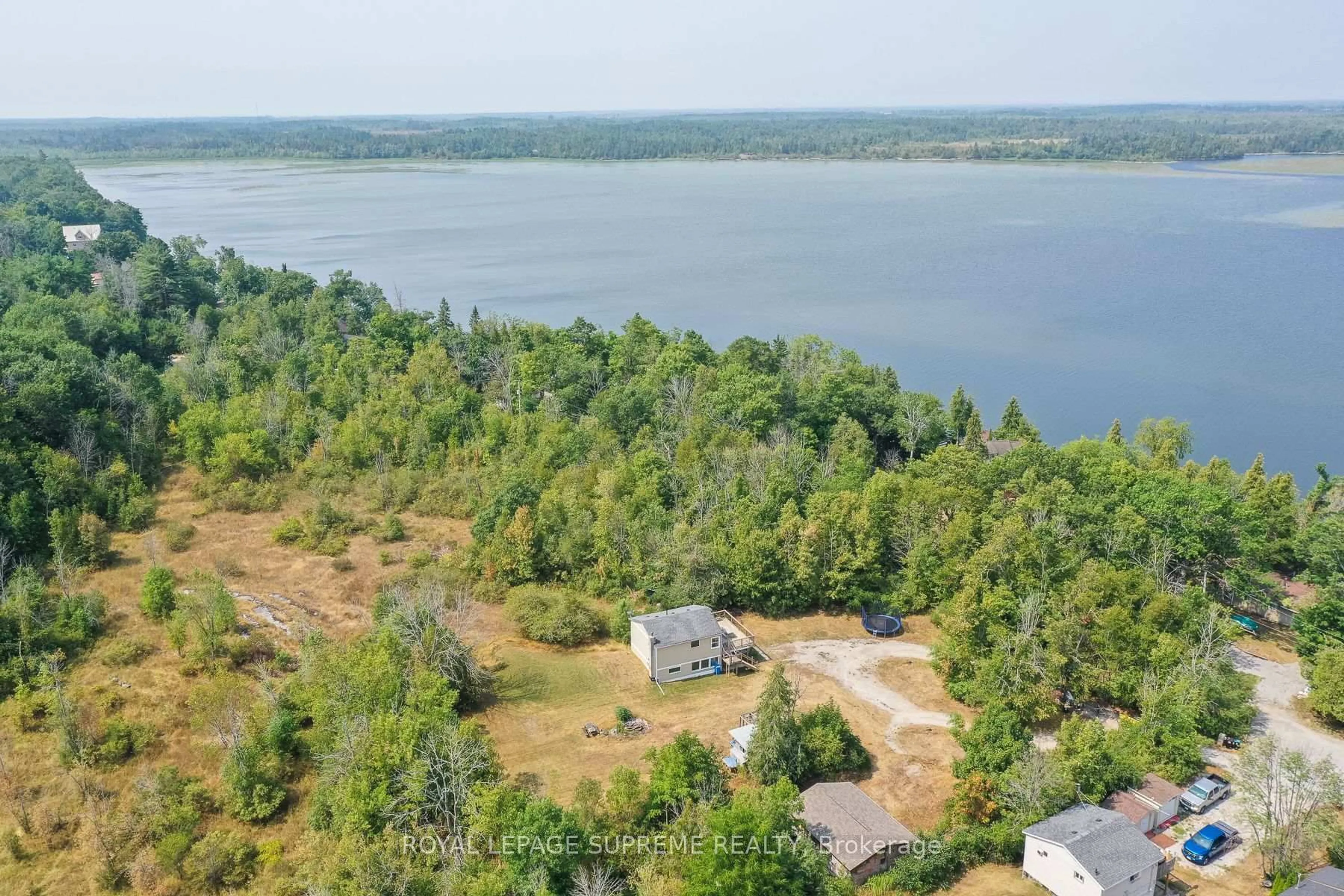 A pic from outside/outdoor area/front of a property/back of a property/a pic from drone, water/lake/river/ocean view for 1157 Sylvan Glen Dr, Ramara Ontario L0K 1B0