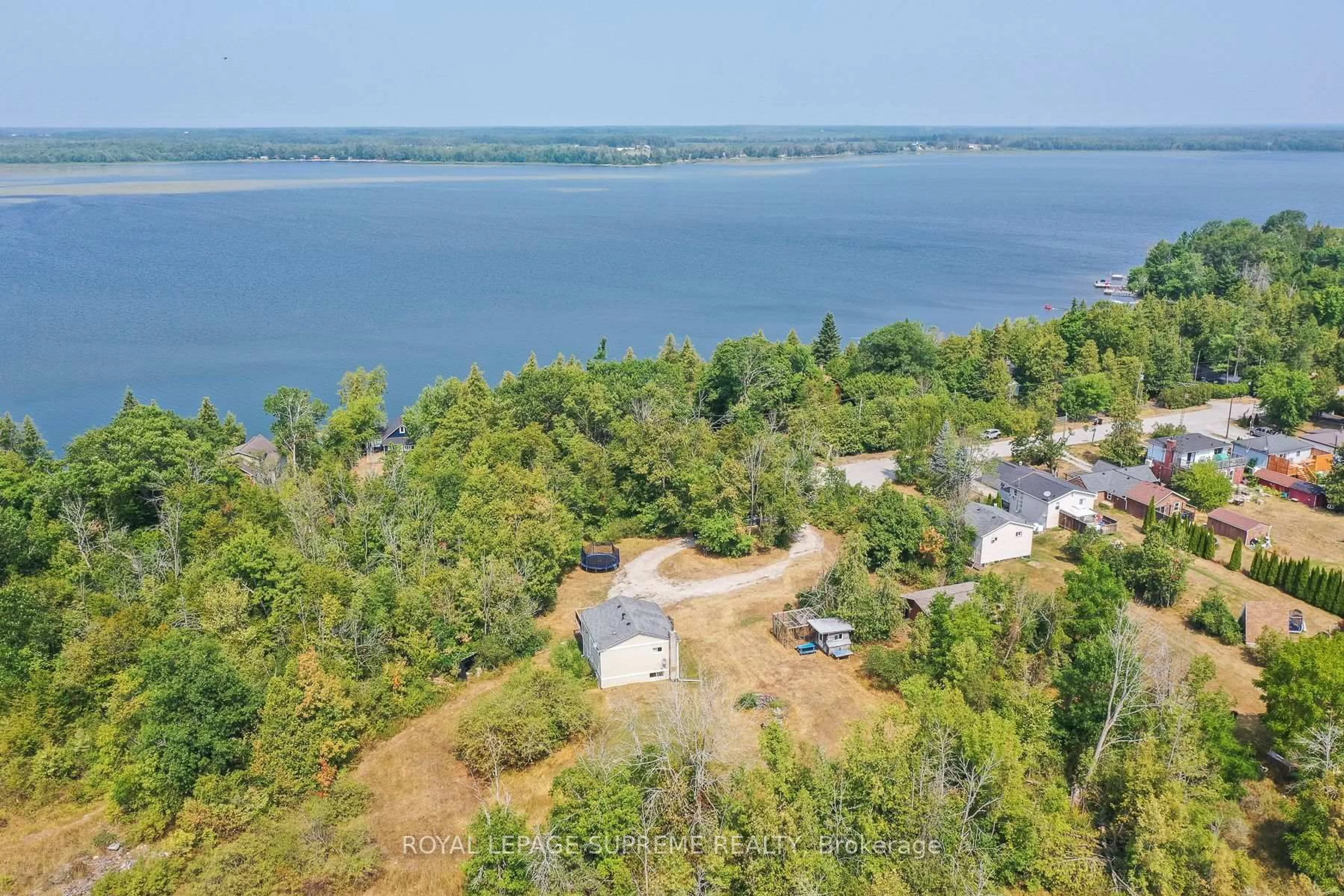 A pic from outside/outdoor area/front of a property/back of a property/a pic from drone, water/lake/river/ocean view for 1157 Sylvan Glen Dr, Ramara Ontario L0K 1B0