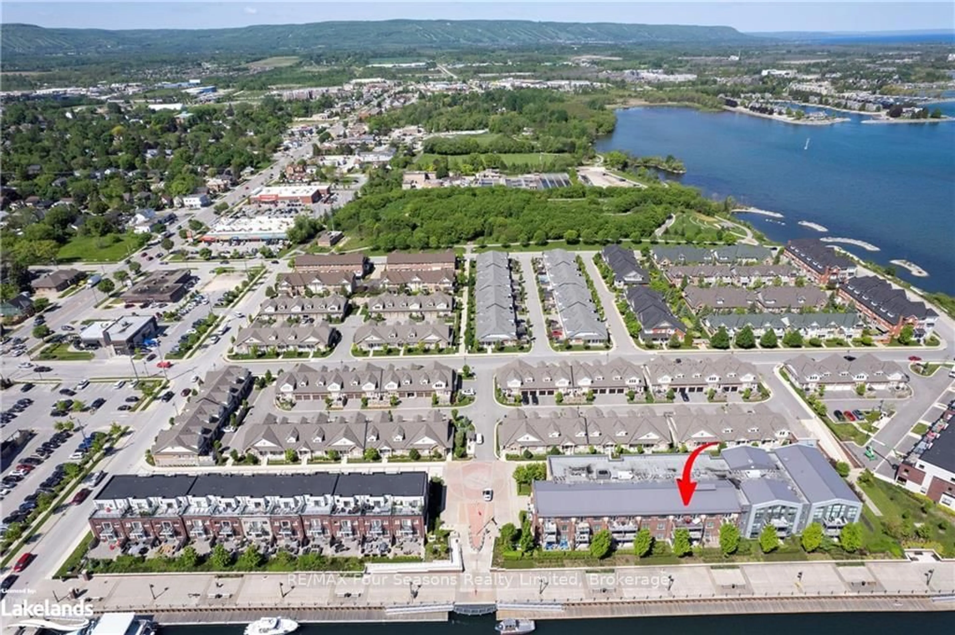 A pic from outside/outdoor area/front of a property/back of a property/a pic from drone, water/lake/river/ocean view for 1 Shipyard Lane #309, Collingwood Ontario L9Y 0W2