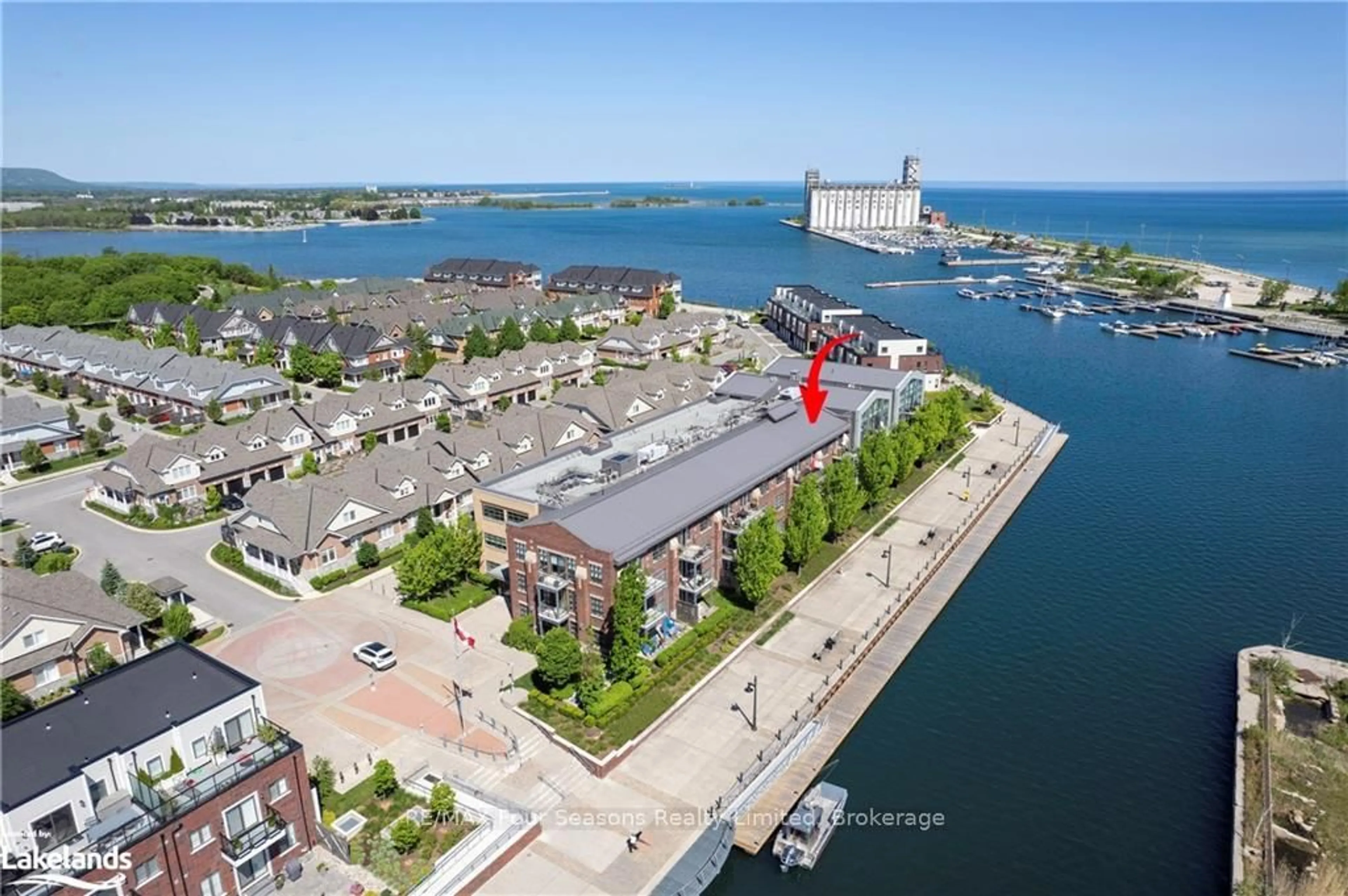 A pic from outside/outdoor area/front of a property/back of a property/a pic from drone, water/lake/river/ocean view for 1 Shipyard Lane #309, Collingwood Ontario L9Y 0W2