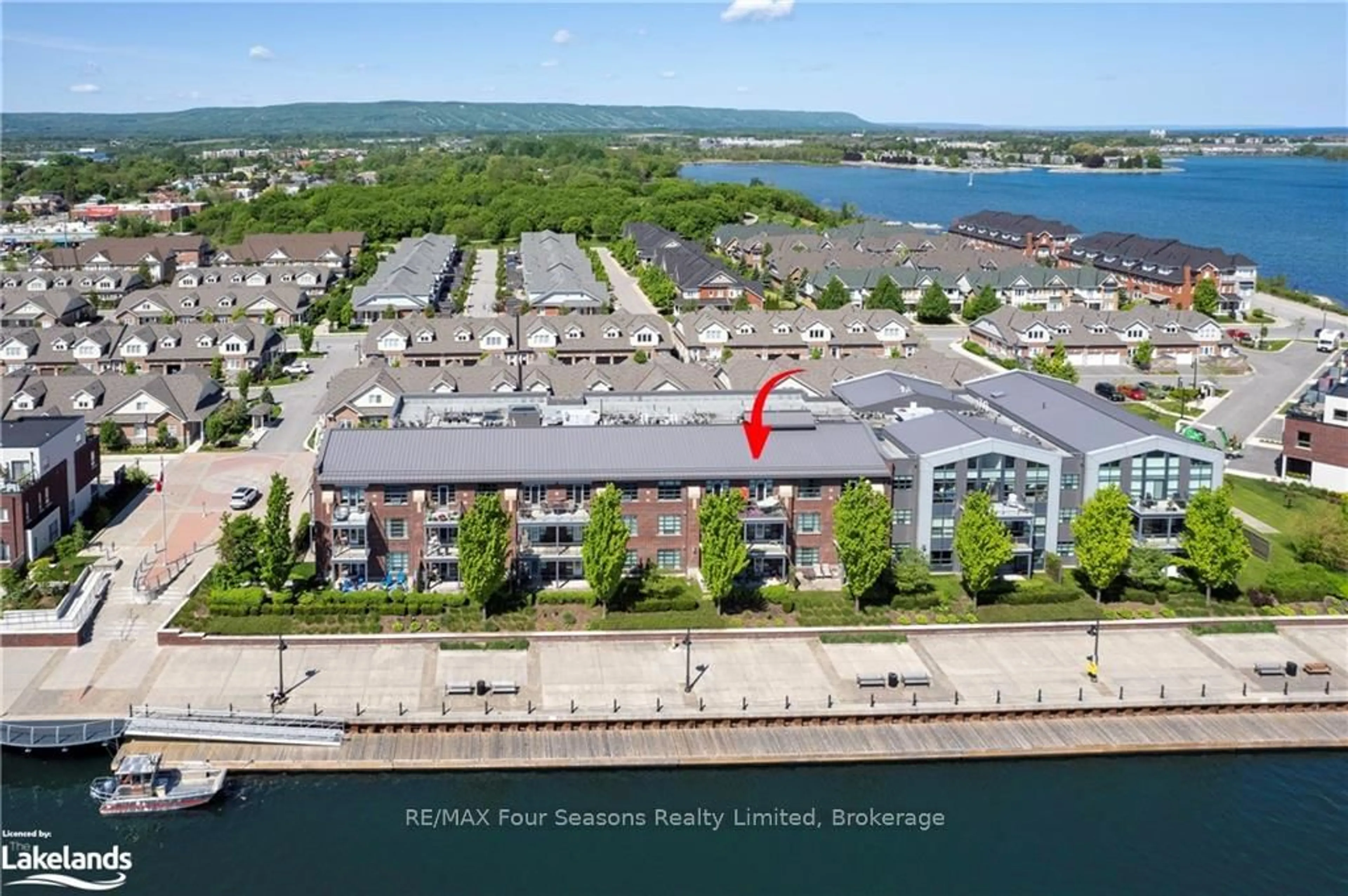 A pic from outside/outdoor area/front of a property/back of a property/a pic from drone, water/lake/river/ocean view for 1 Shipyard Lane #309, Collingwood Ontario L9Y 0W2