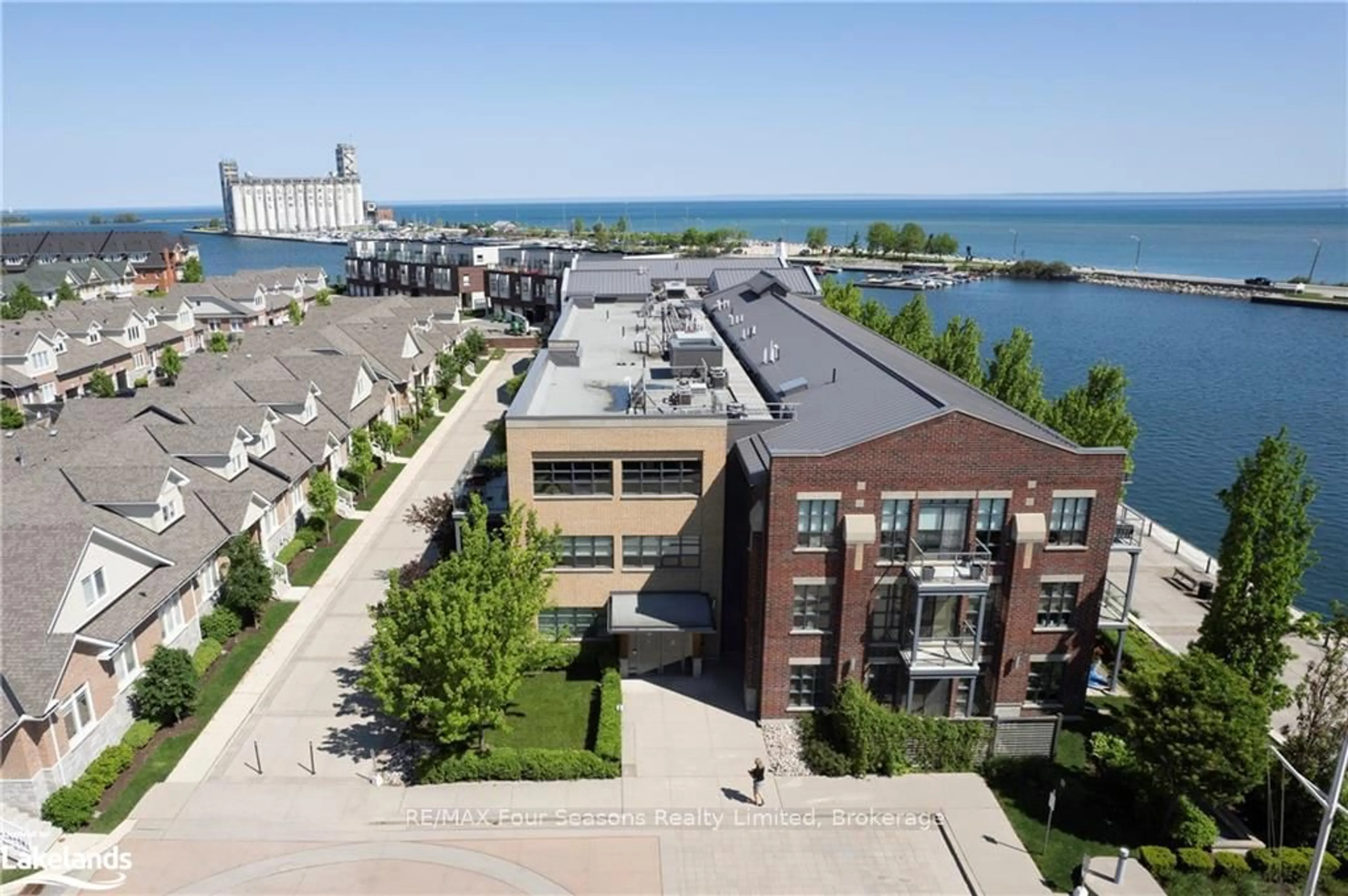 A pic from outside/outdoor area/front of a property/back of a property/a pic from drone, water/lake/river/ocean view for 1 Shipyard Lane #309, Collingwood Ontario L9Y 0W2