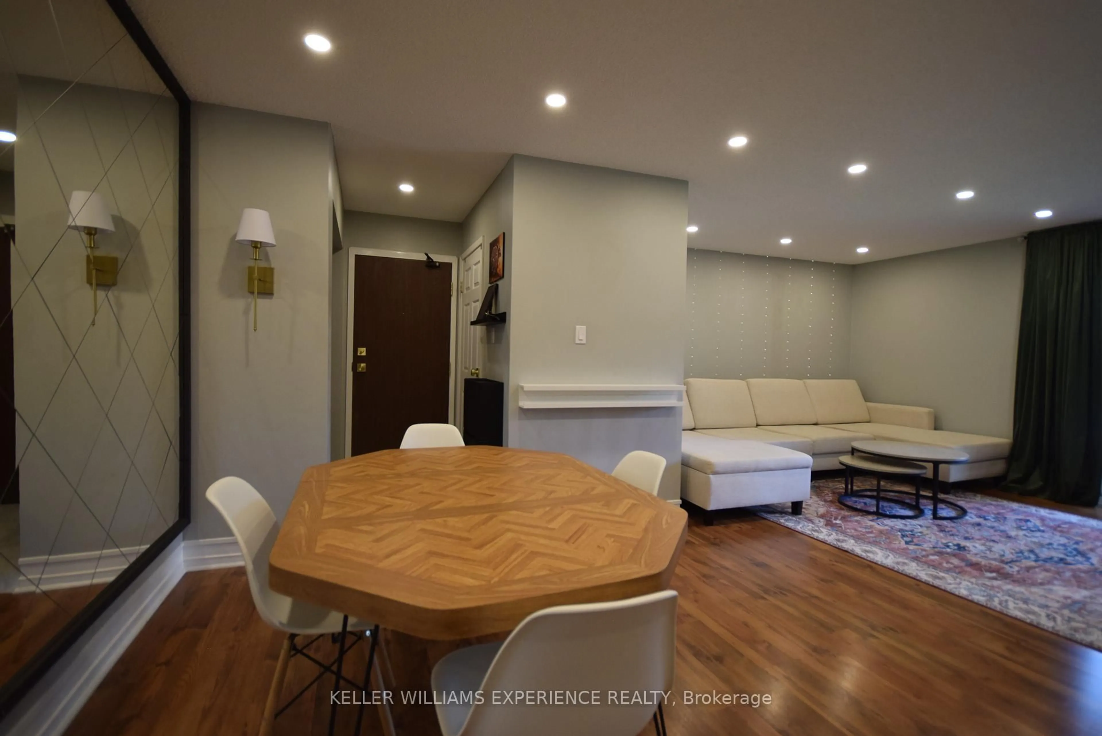 Living room with furniture, wood/laminate floor for 167 Edgehill Dr #E8, Barrie Ontario L4N 1L9
