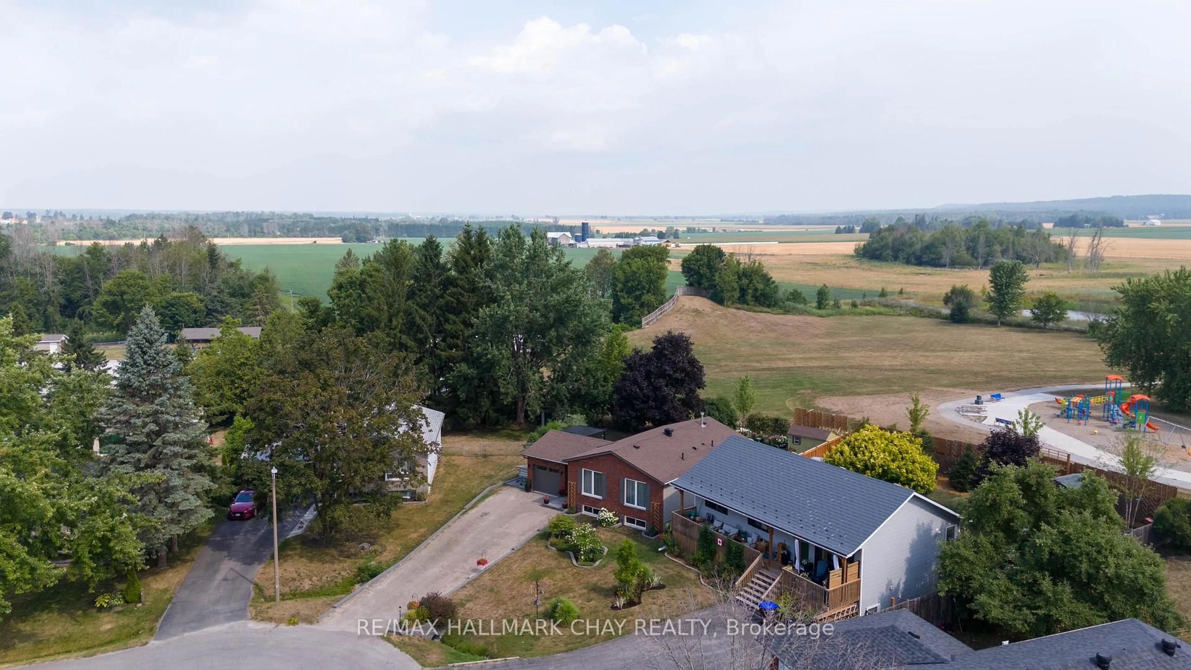 A pic from outside/outdoor area/front of a property/back of a property/a pic from drone, water/lake/river/ocean view for 55 Shaw St, Springwater Ontario L0L 1P0