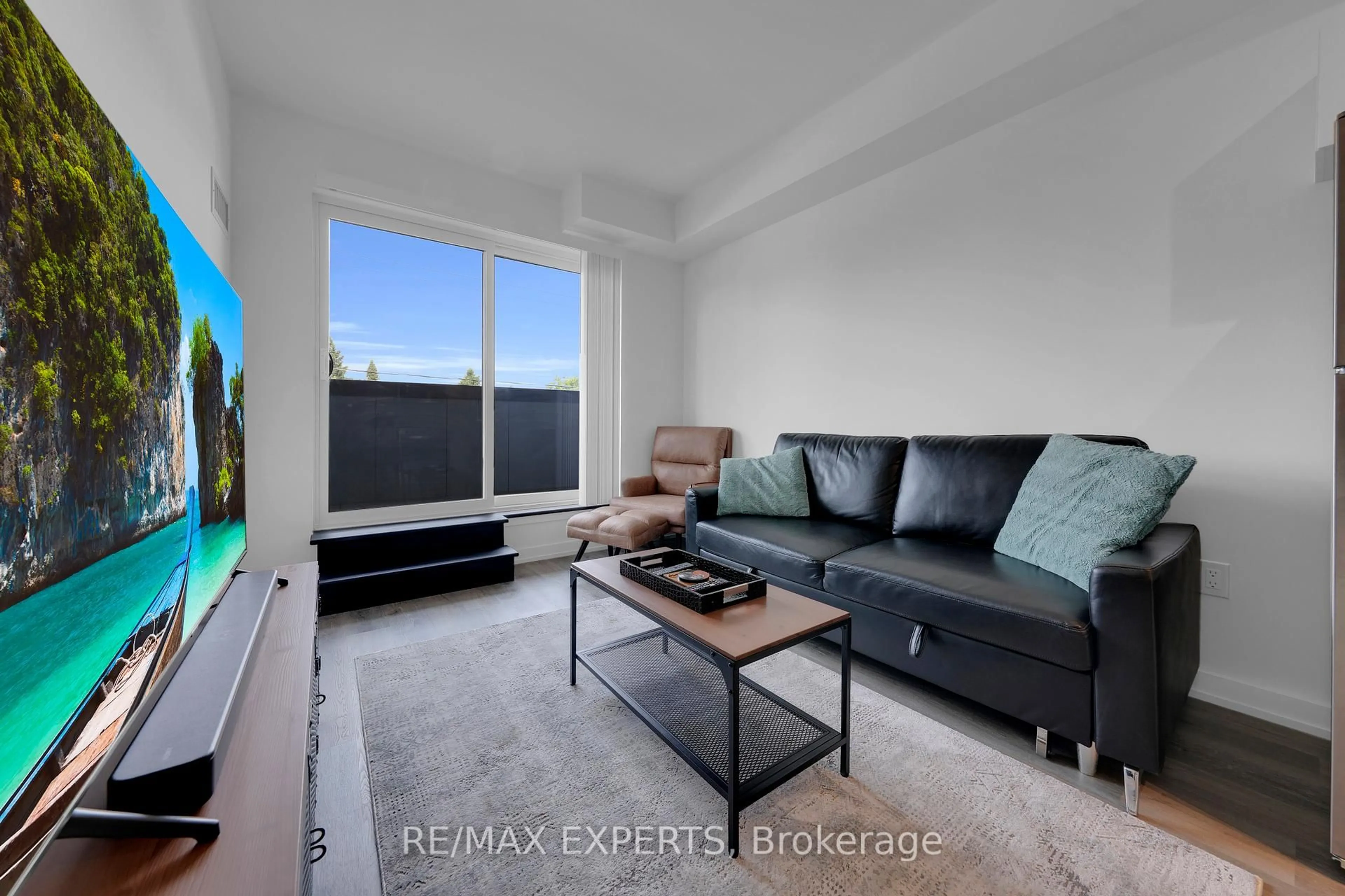 Living room with furniture, unknown for 430 Essa Rd #209, Barrie Ontario L9J 0M1
