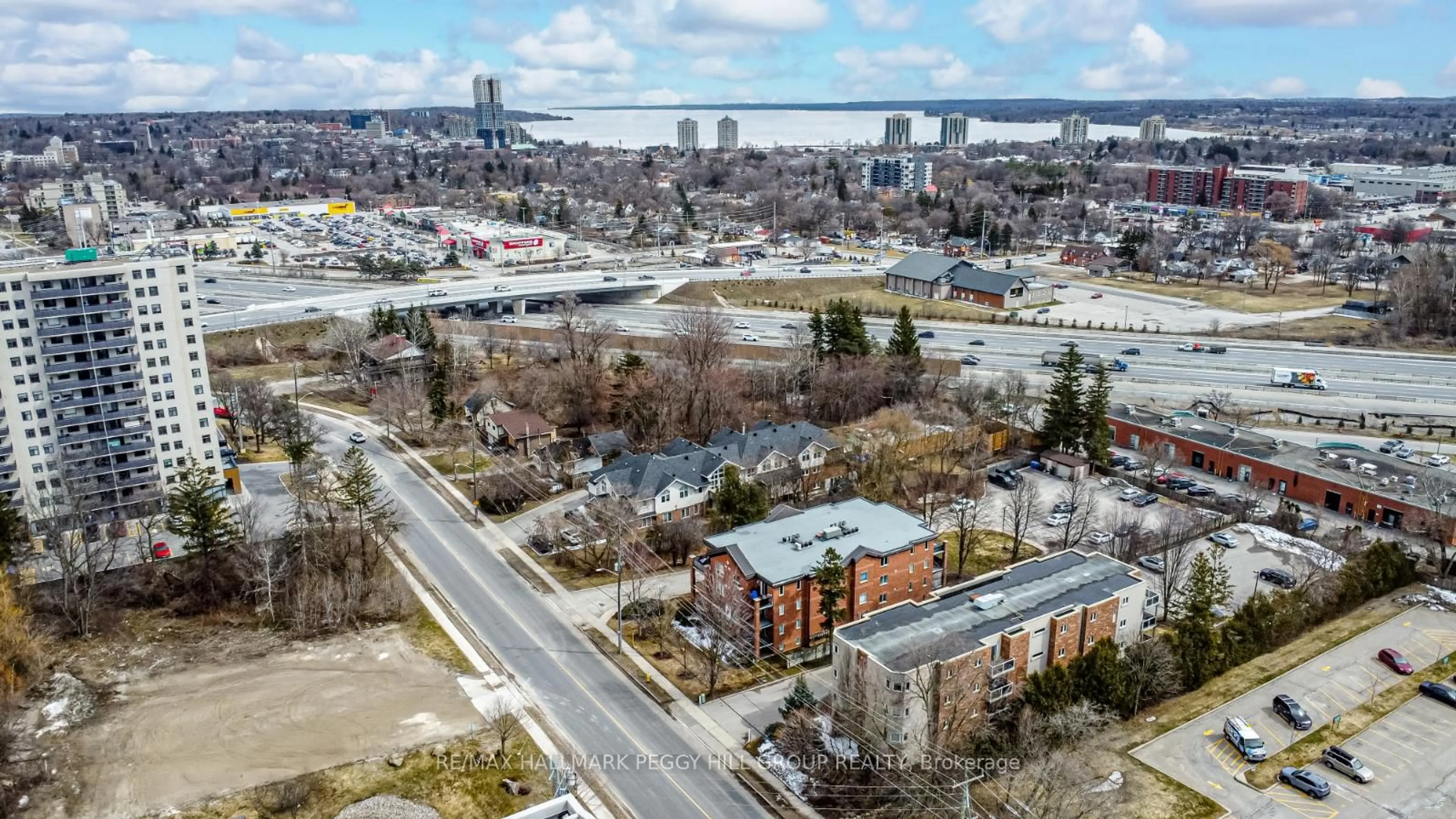 A pic from outside/outdoor area/front of a property/back of a property/a pic from drone, city buildings view from balcony for 117 Edgehill Dr #203, Barrie Ontario L4N 1L9
