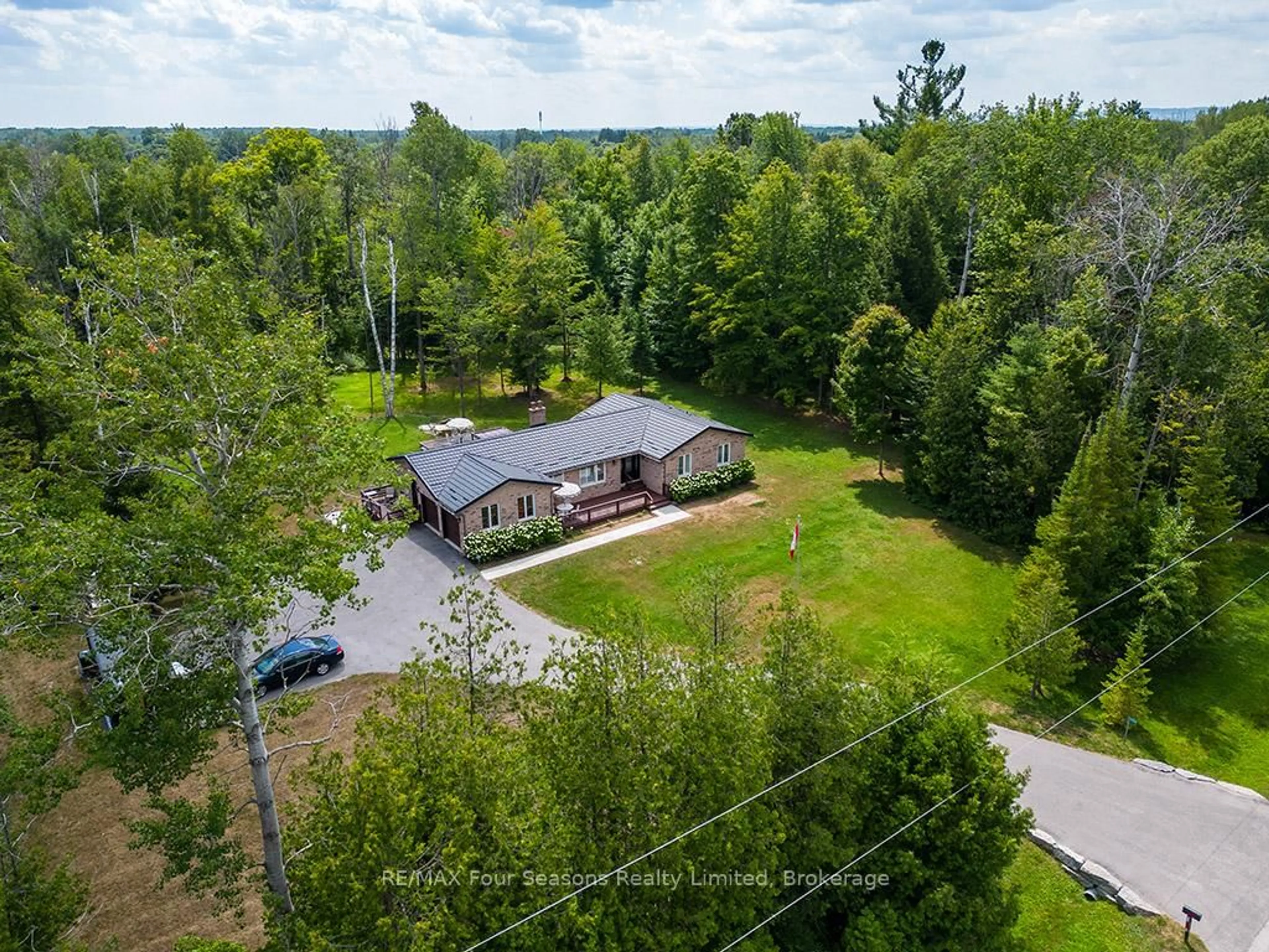 A pic from outside/outdoor area/front of a property/back of a property/a pic from drone, forest/trees view for 5259 Sunnidale Concession  5 Rd, Clearview Ontario L0M 1N0