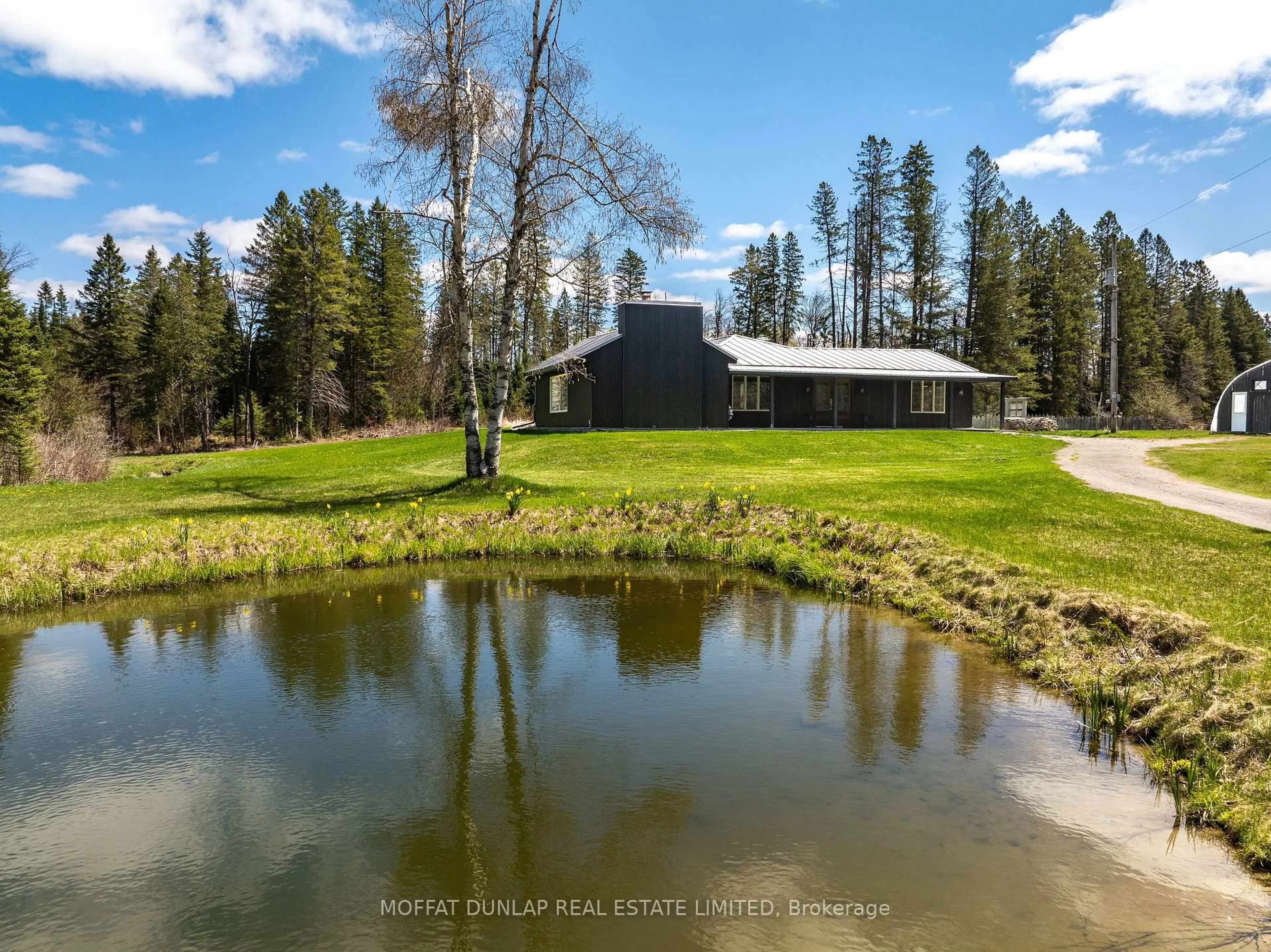 A pic from outside/outdoor area/front of a property/back of a property/a pic from drone, water/lake/river/ocean view for 1076 Beaver Lane, Springwater Ontario L9X 0M1